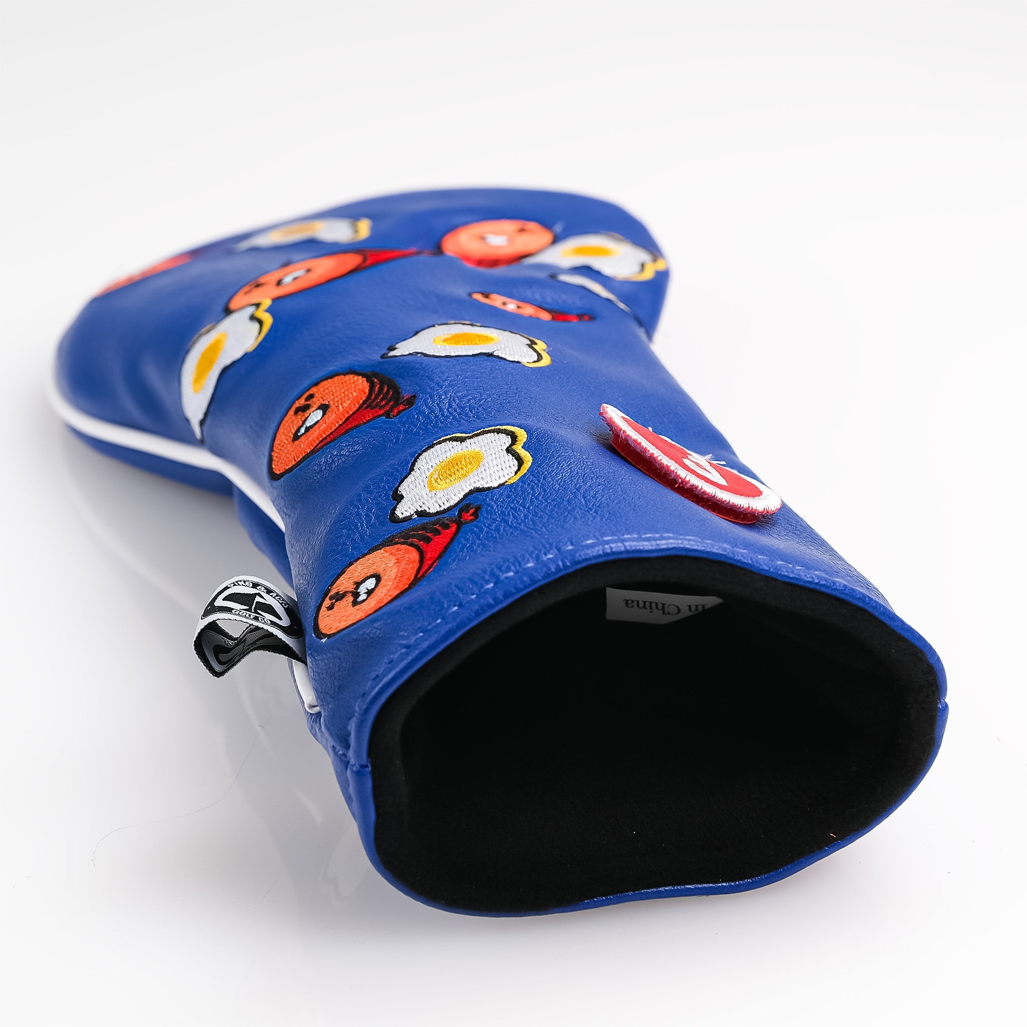 Inside detail of the Ham & Eggs Fairway Cover, featuring a vibrant design with a classic breakfast theme.