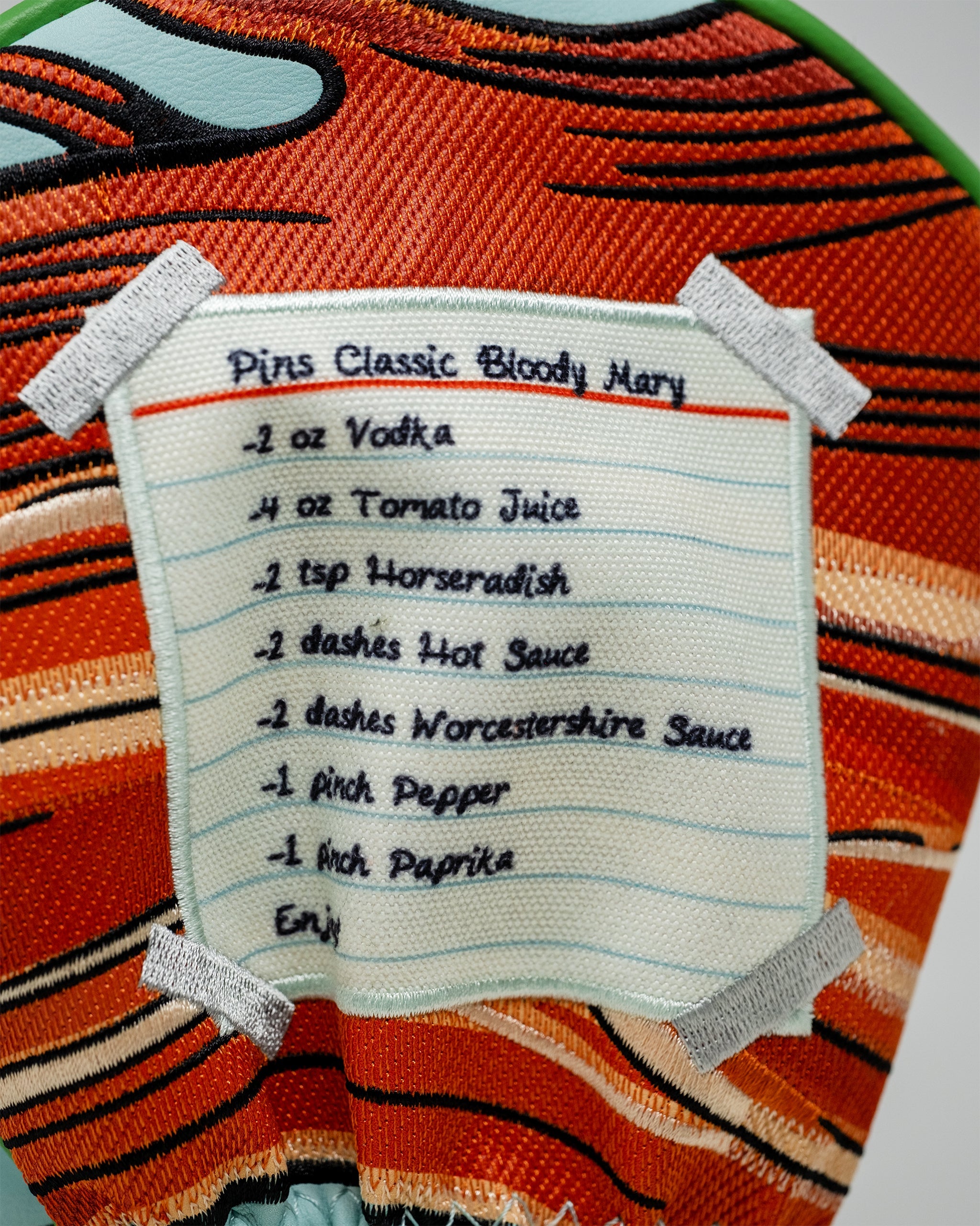 Bloody Mary driver cover featuring a vibrant tomato design and playful cocktail graphics.