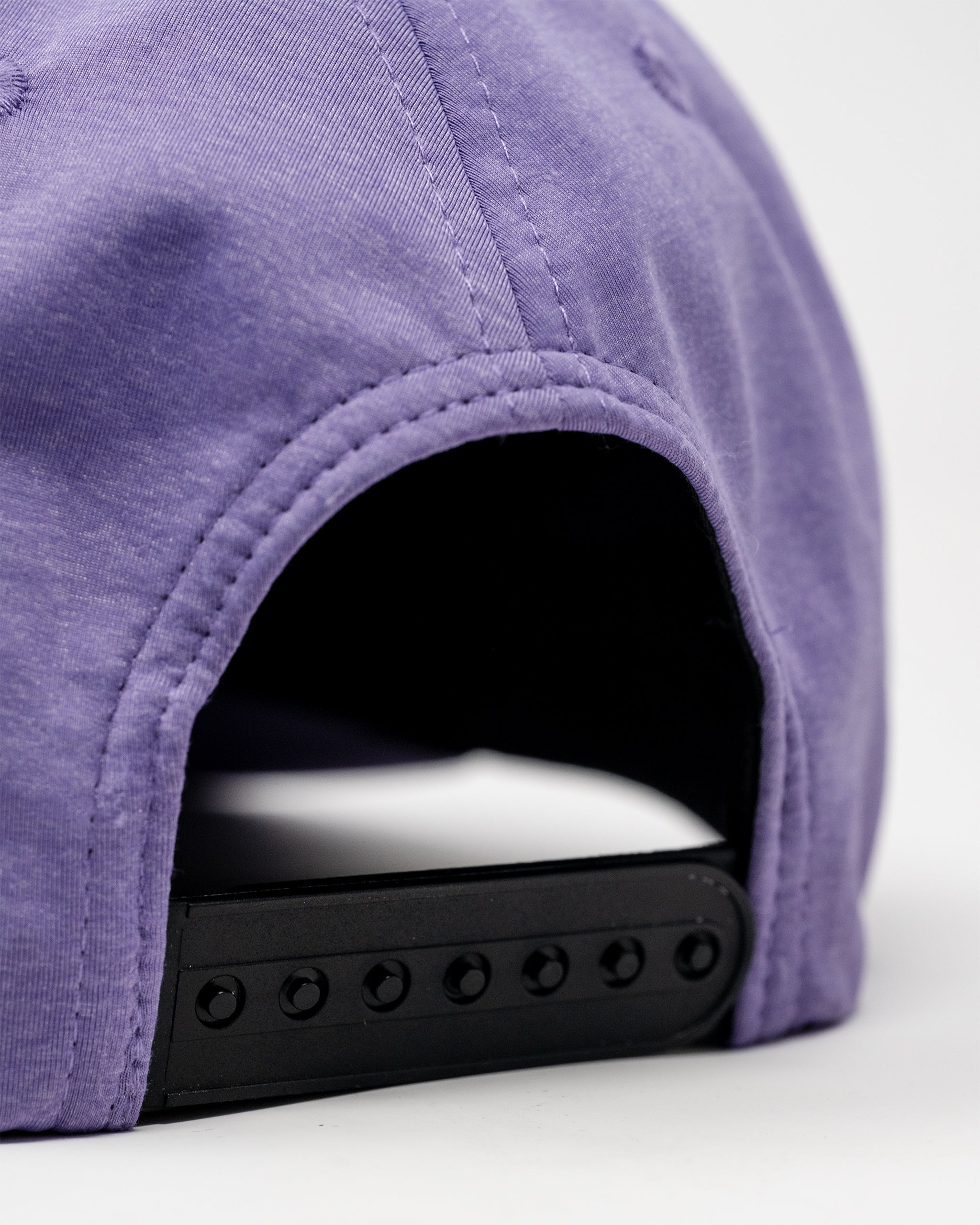 Performance Spade Hat in Lavender, featuring a snapback design and stylish logo detail.