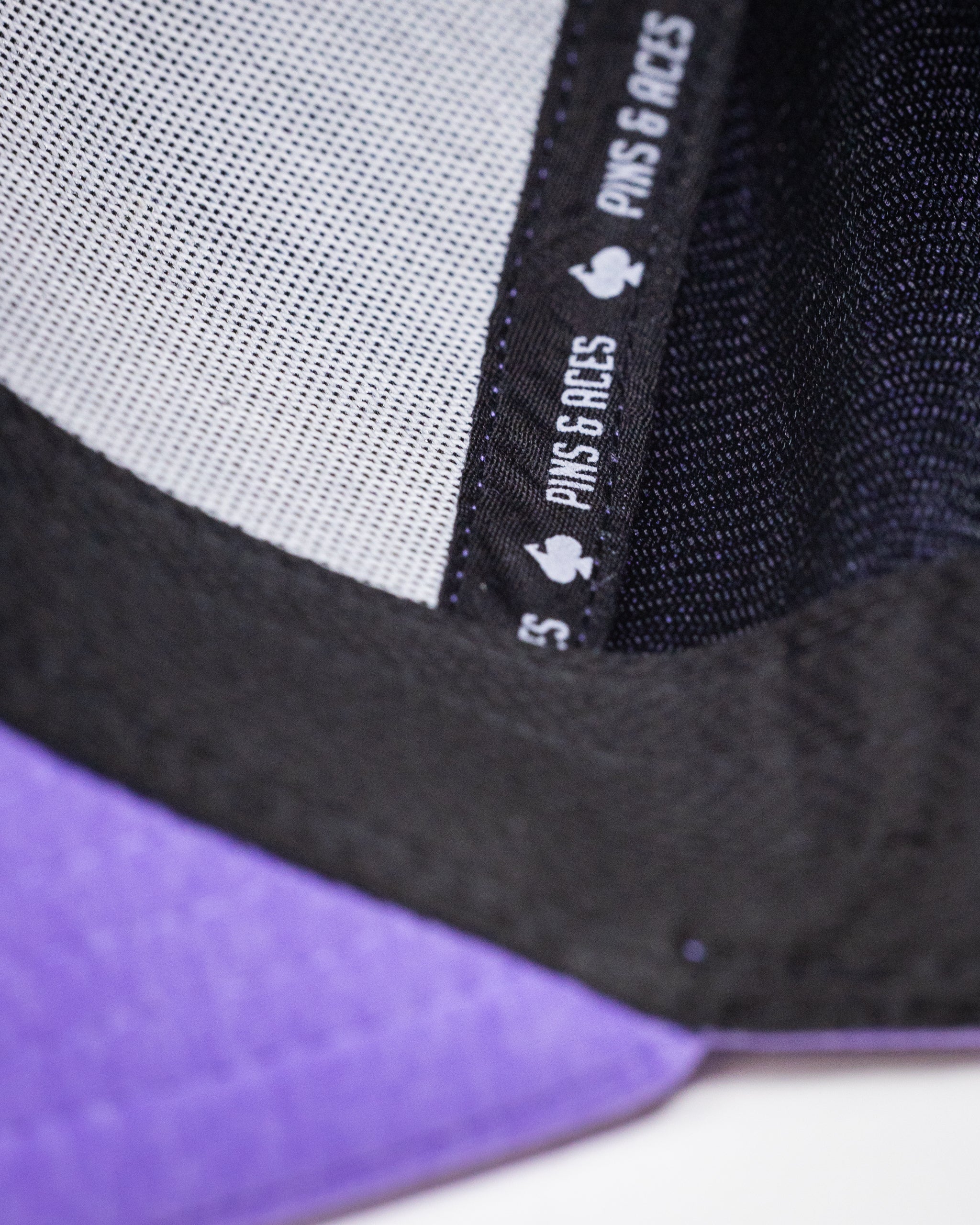 Performance Spade Hat in Lavender with adjustable strap and breathable fabric.