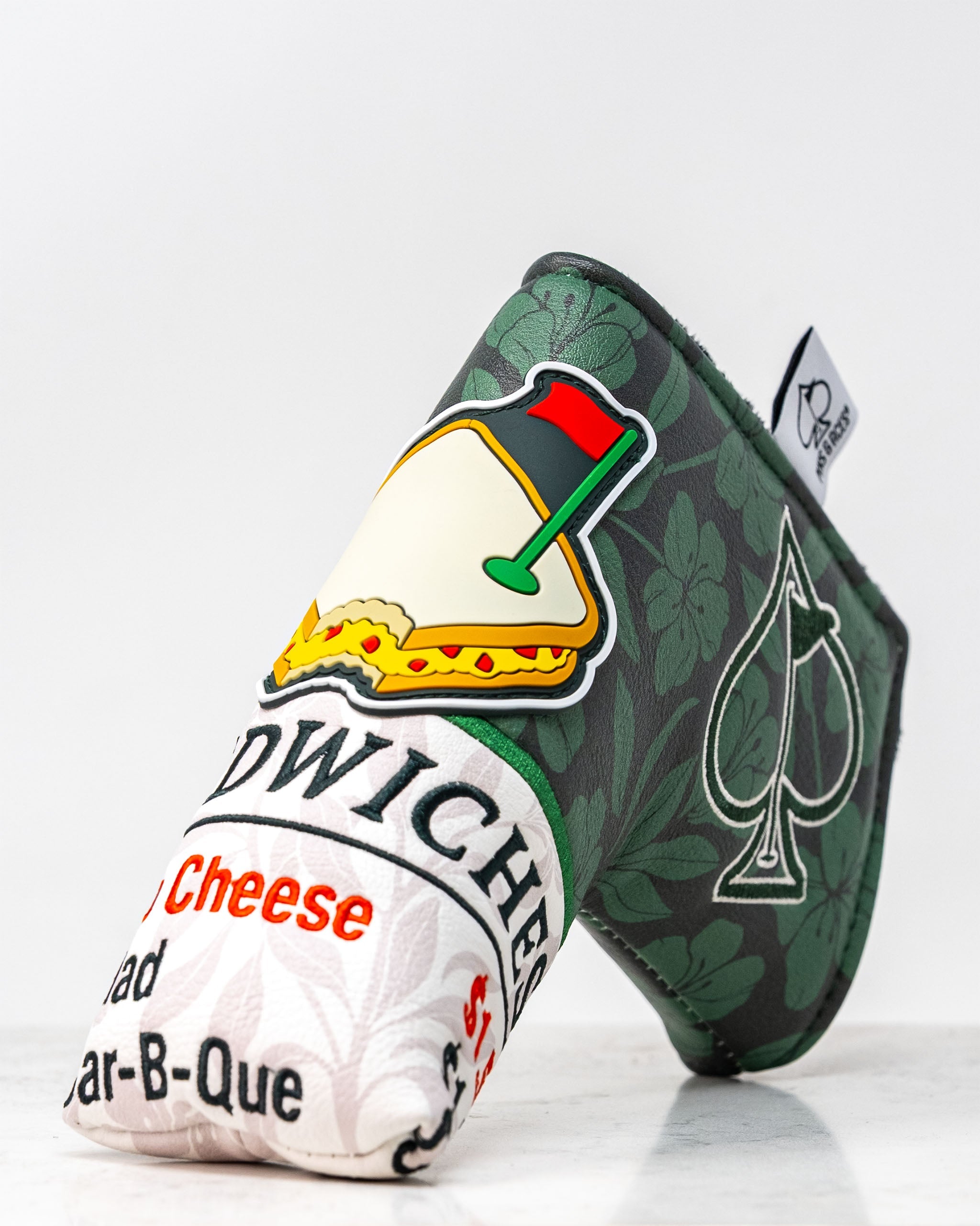 Augusta '25 Blade Putter Cover, featuring a vibrant green design with intricate detailing, perfect for protecting your putter on the golf course.