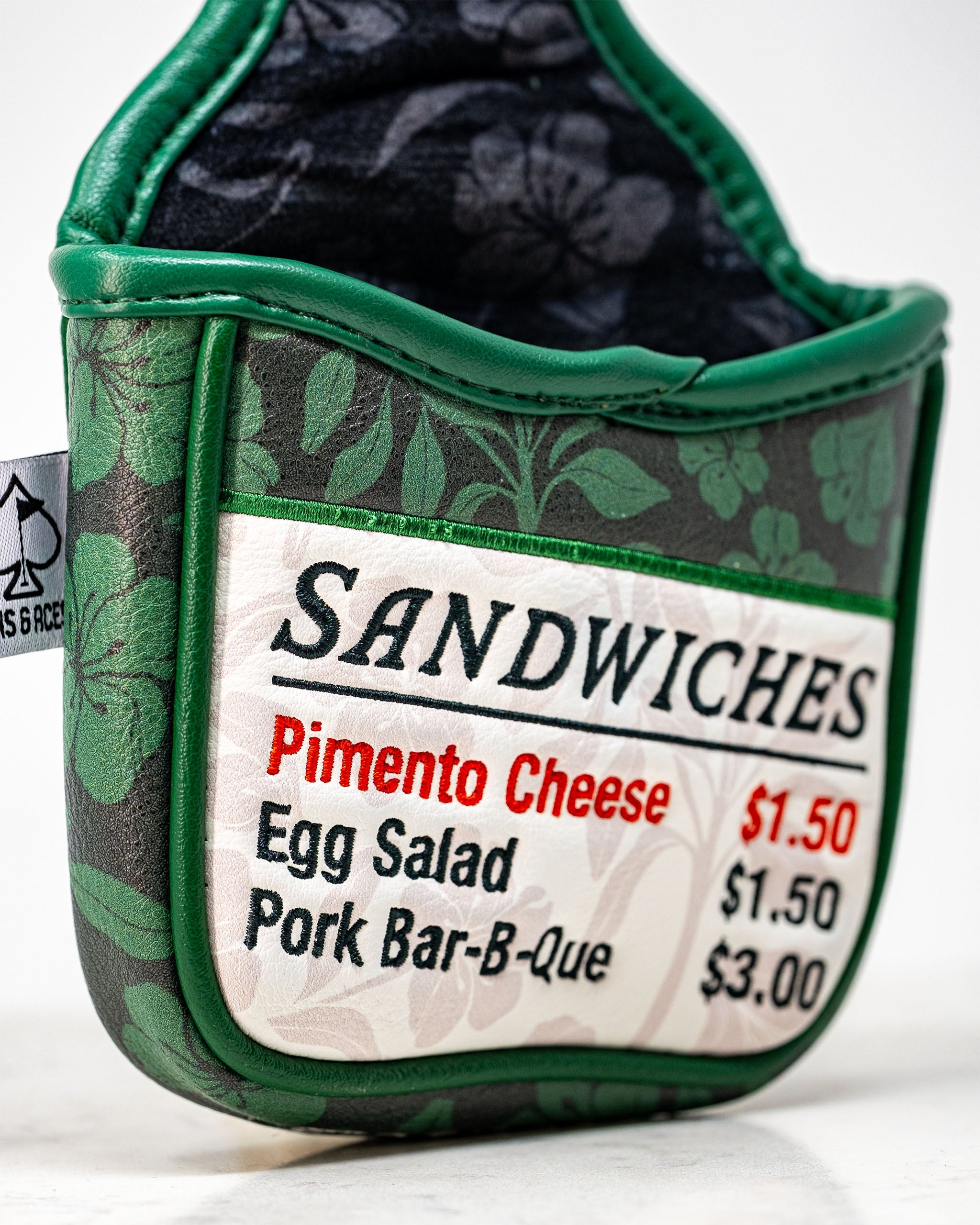 Augusta '25 mallet putter cover featuring a vibrant green design with gold accents and a snug fit for added protection.