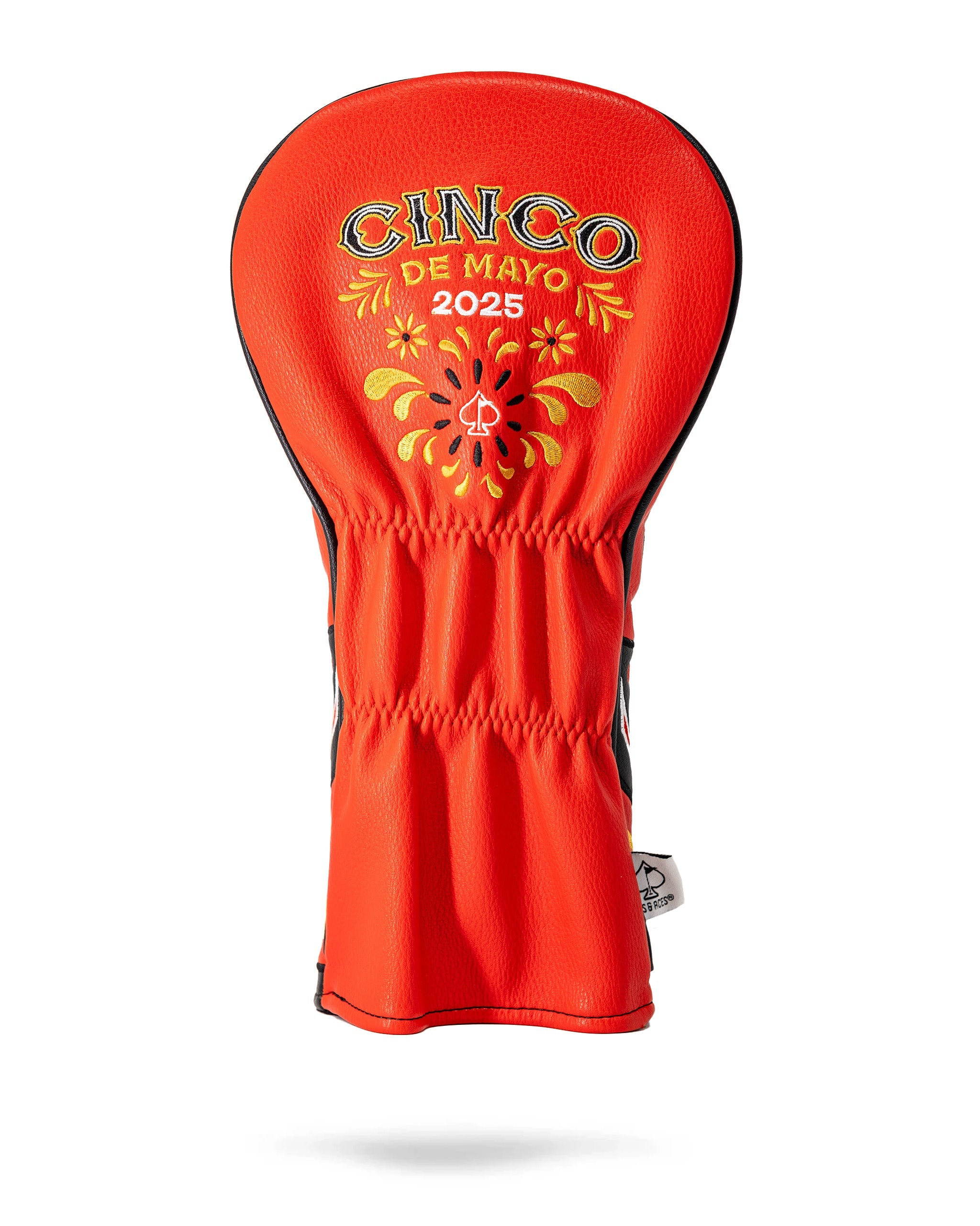 Red lucha libre driver cover with embroidered "Cinco de Mayo 2025" and festive yellow and black floral designs.