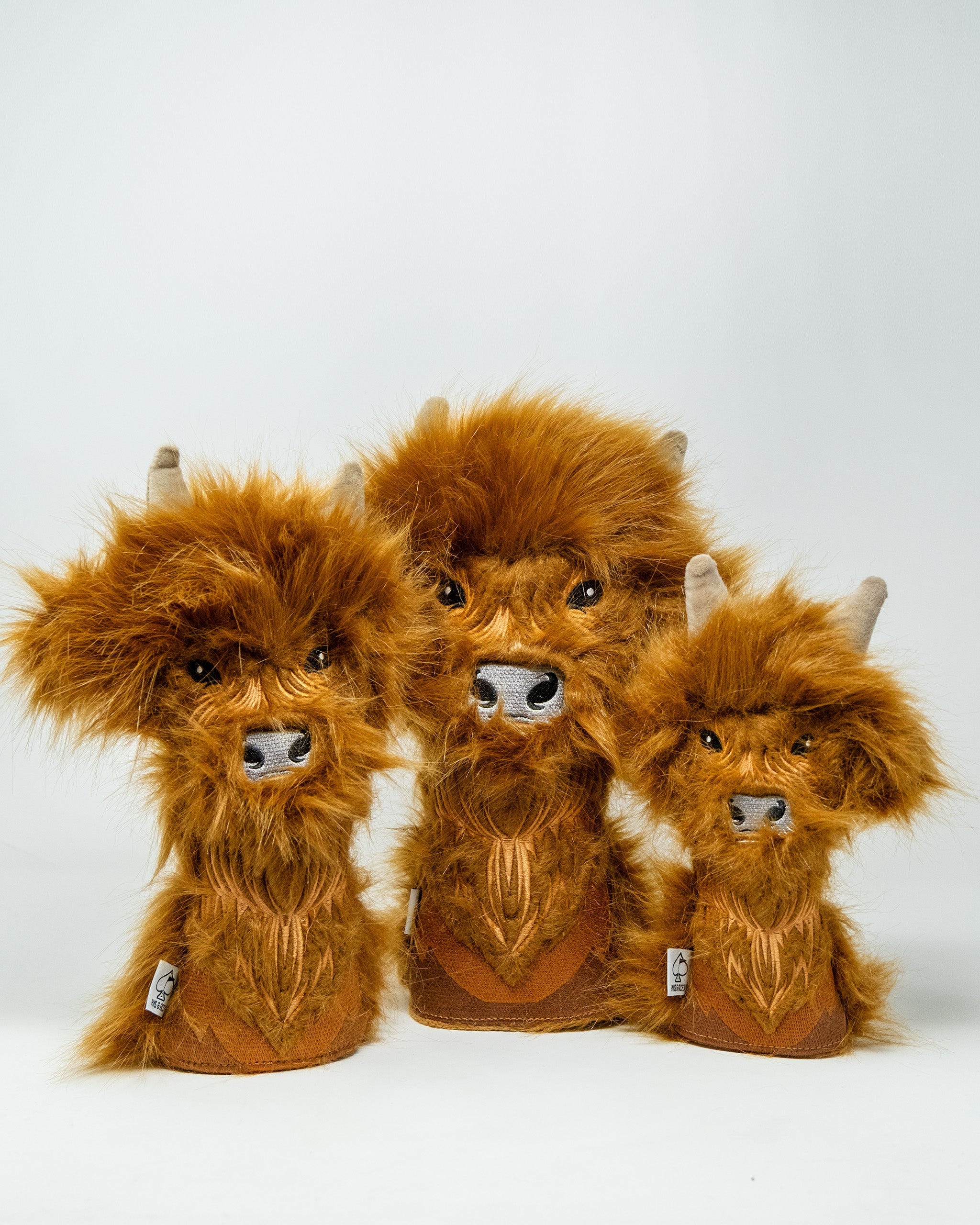 Highland Cow fairway golf club covers with plush fur and detailed facial features, designed for protection and style.