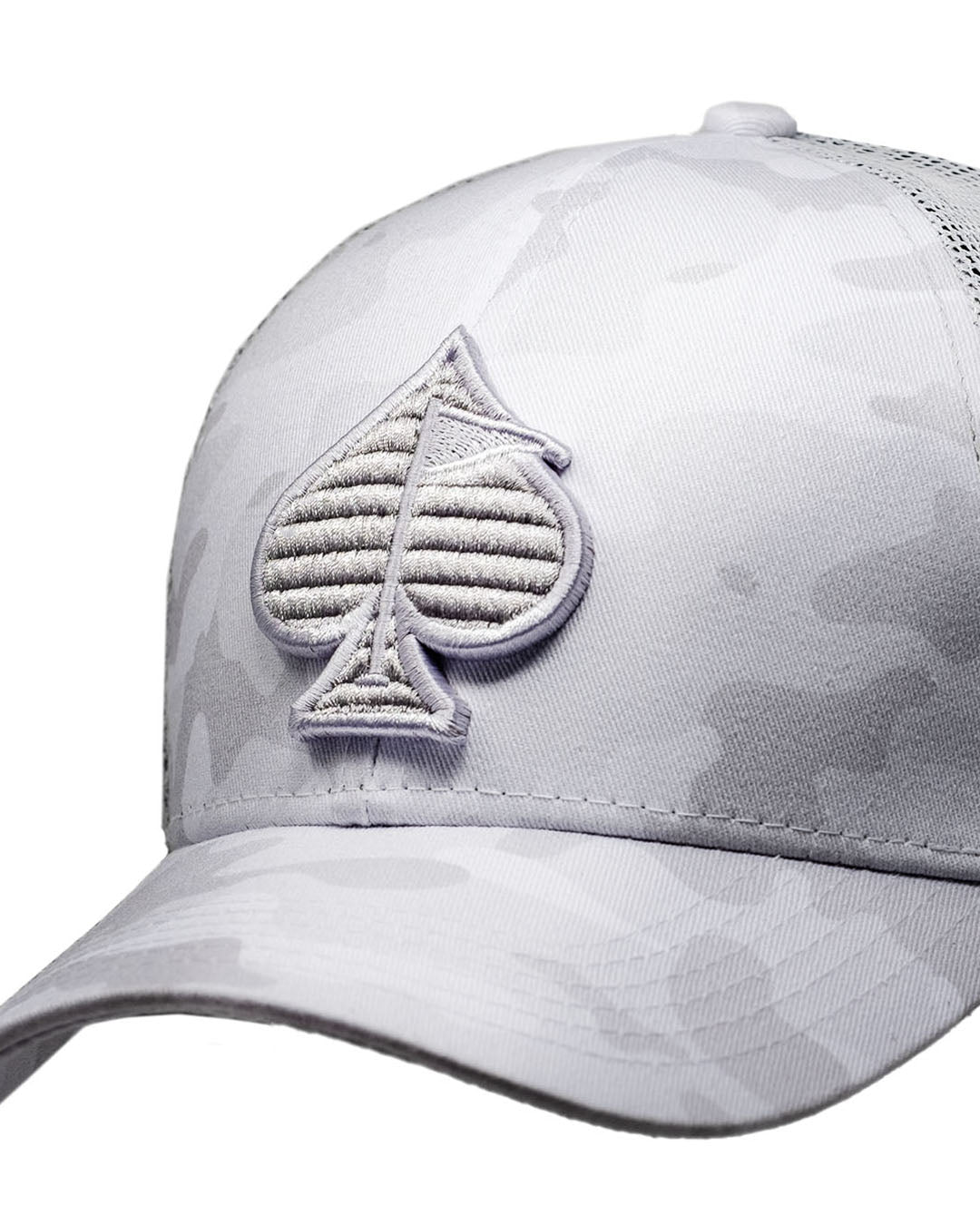 Trucker hat in Arctic camo design, featuring a mesh back and a cotton candy color accent.