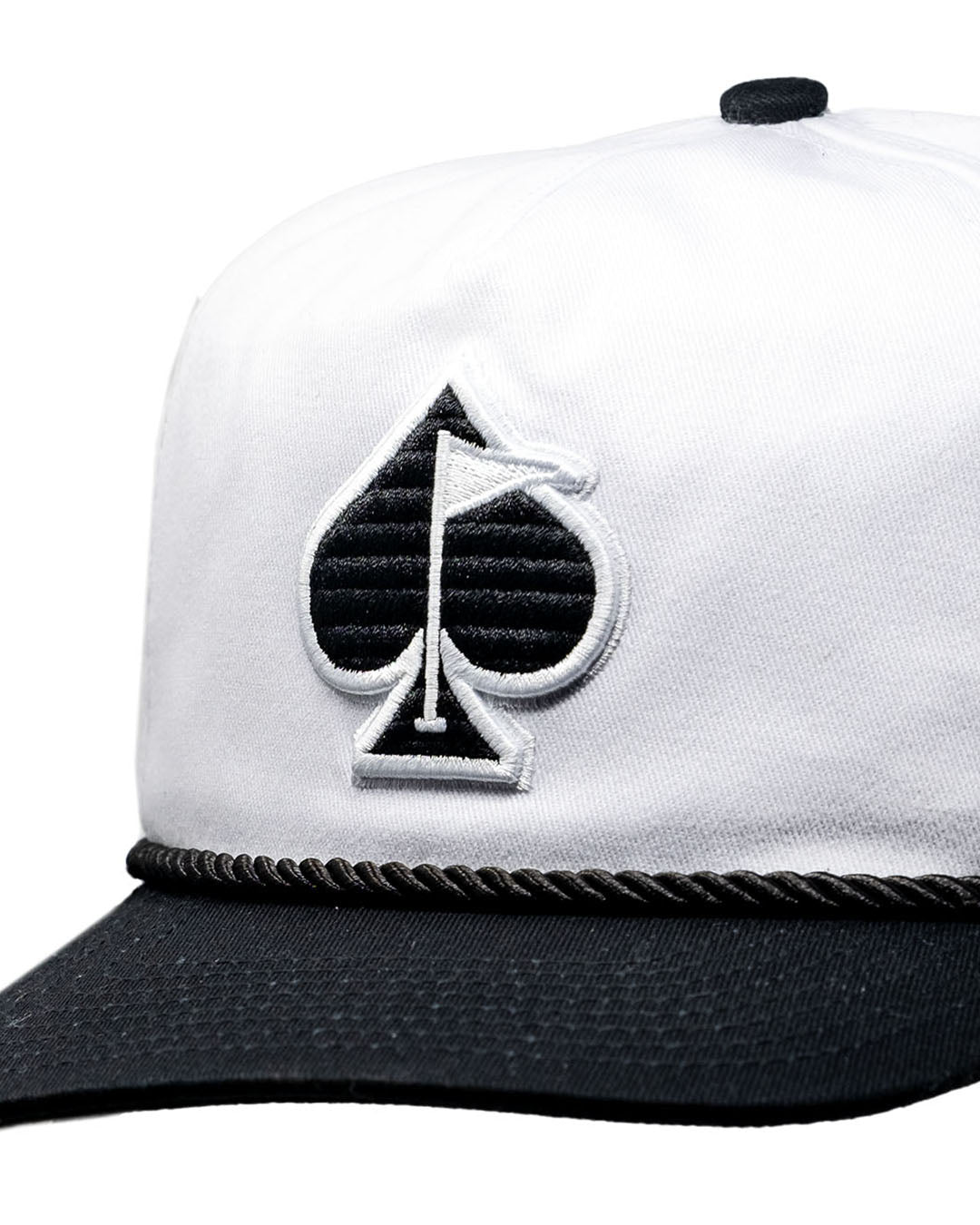 Heritage Rope Hat in Domino color, featuring a classic trucker style and detailed spade design on the front.