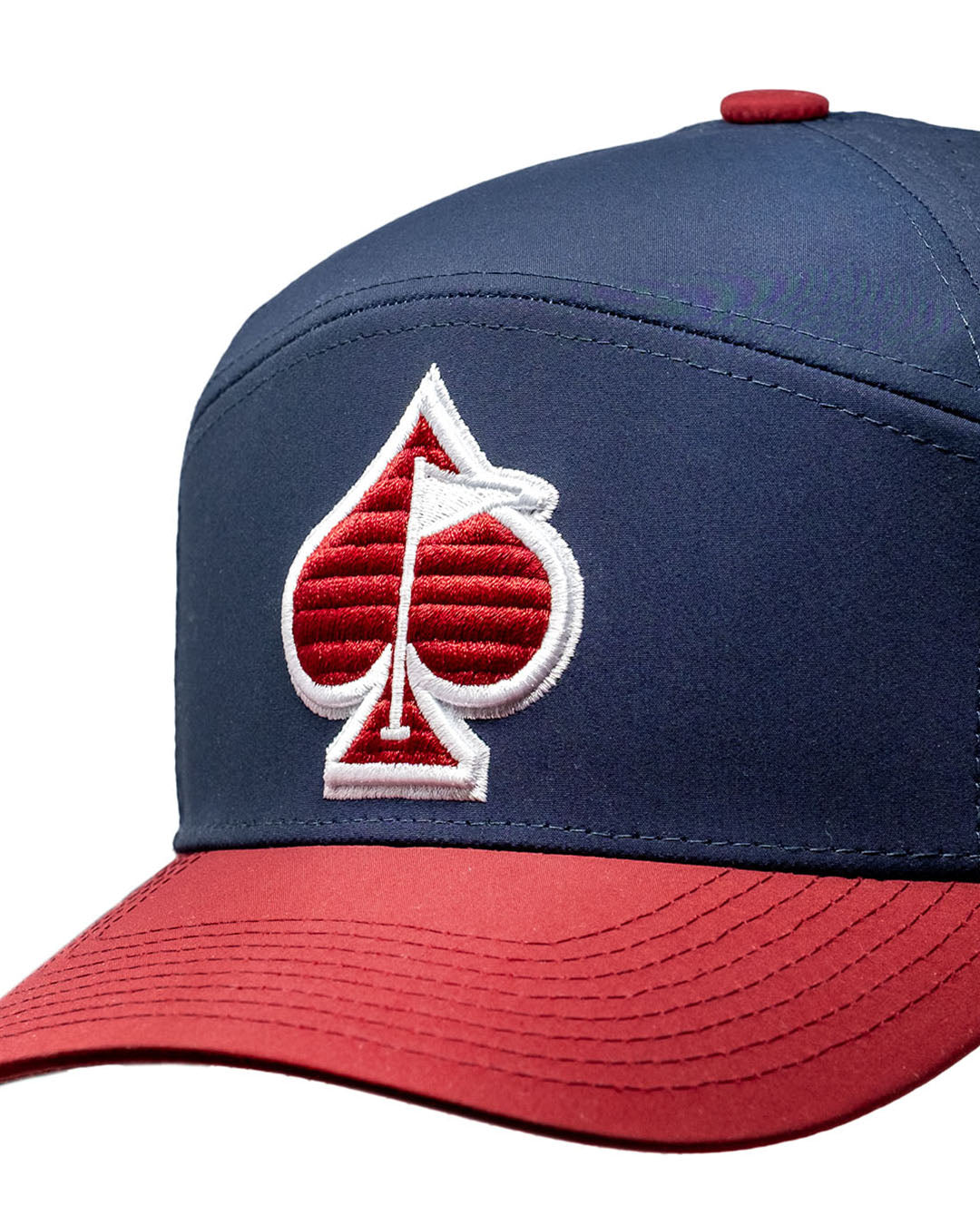 Alt text: "Front view of the Tradesman Hat - Patriot, featuring a classic trucker design with a navy and red color scheme and a patriotic emblem."