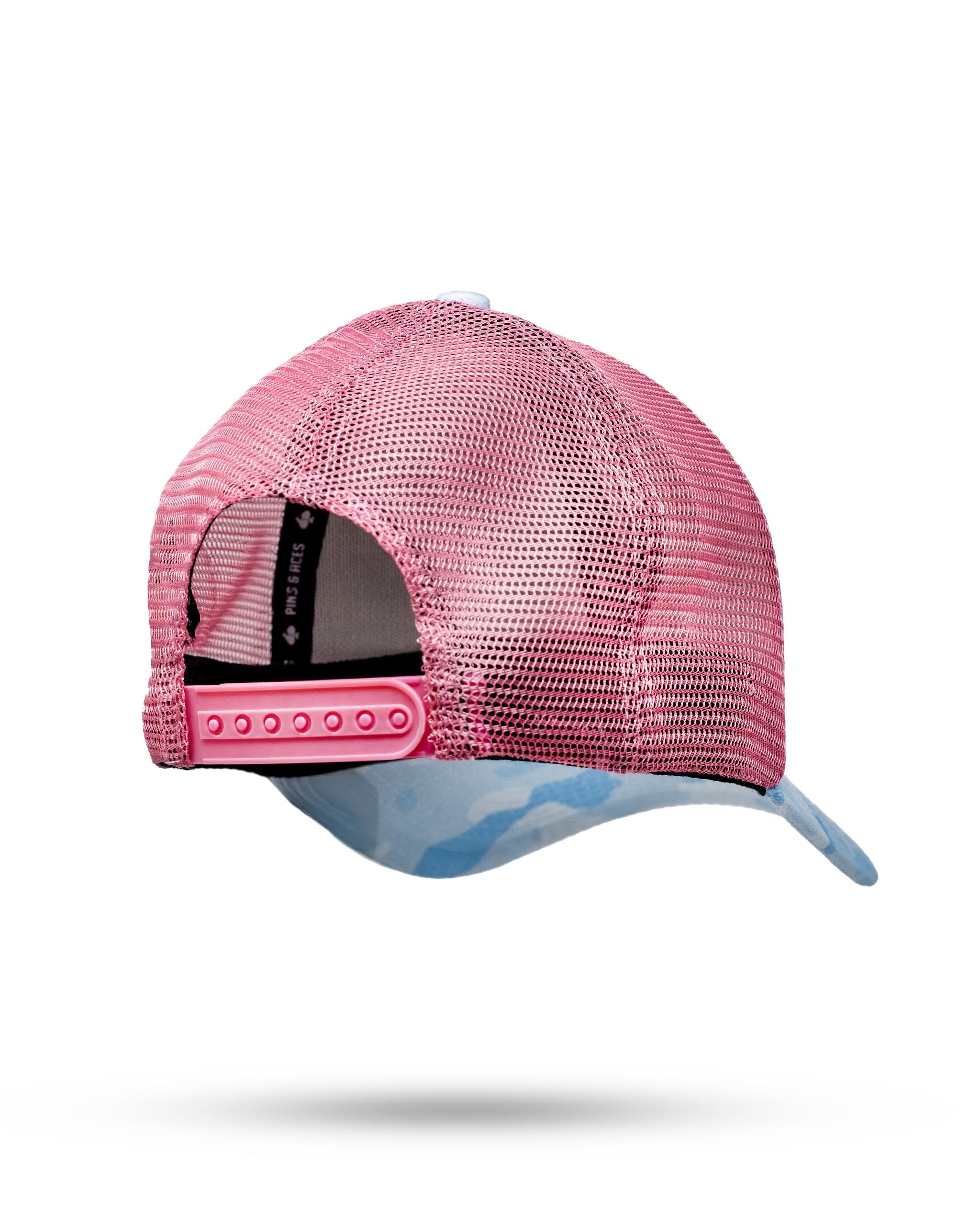 Cotton Candy Camo trucker hat featuring a vibrant pink and blue camouflage pattern, with a mesh back for breathability and an adjustable snapback closure.