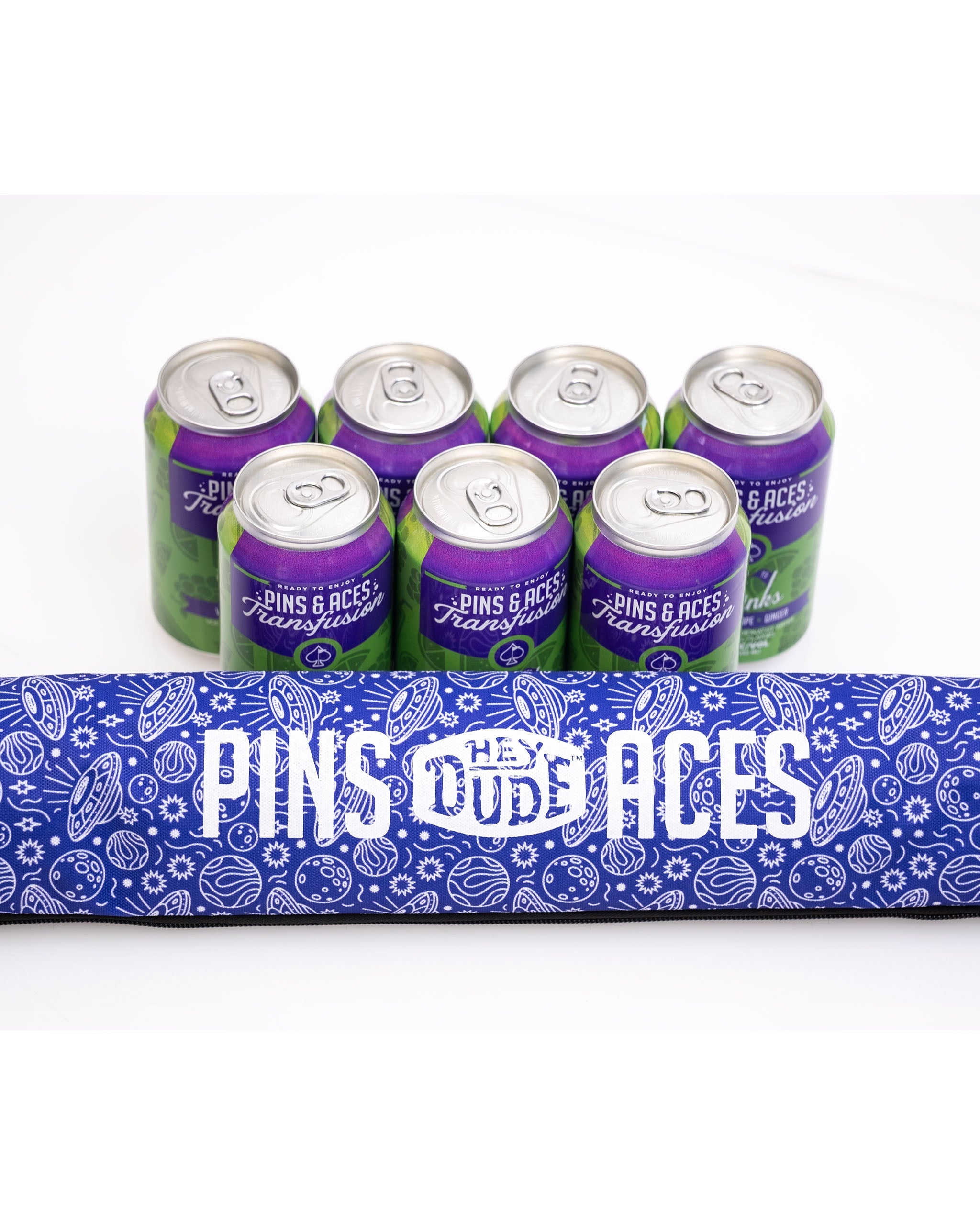 Alt text: HEYDUDE Beer Sleeve in Indigolactic design, featuring a vibrant blue and galaxy pattern, ideal for keeping beverages cool.