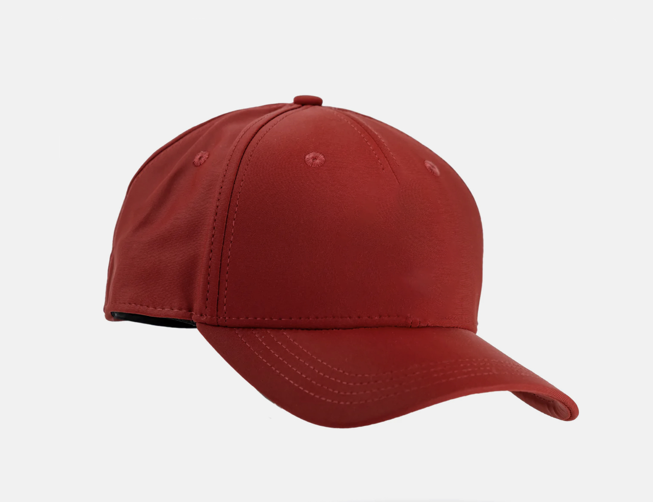 Red golf cap with bold stitching and a curved brim, perfect for golfers who want to stand out on the course.