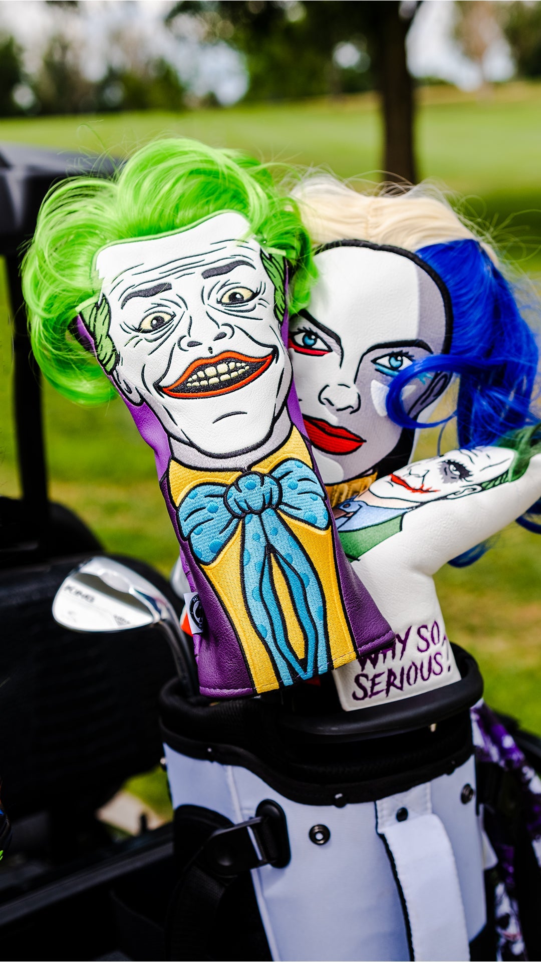 Alt text: The Quinn driver cover featuring a joker design, displayed in a golf bag alongside a Harley Davidson logo.