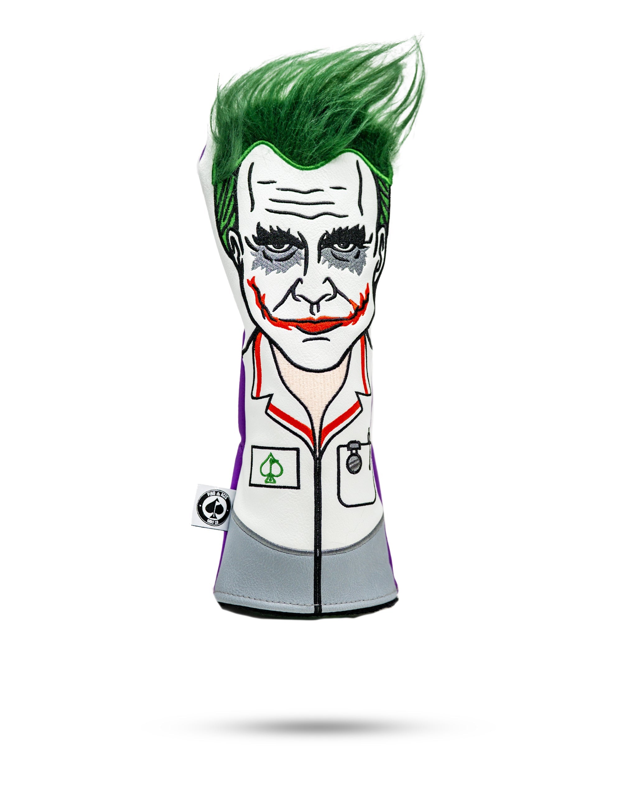 Golf headcover featuring a Joker-inspired face with green hair, white coat, and bold makeup for standout course style.