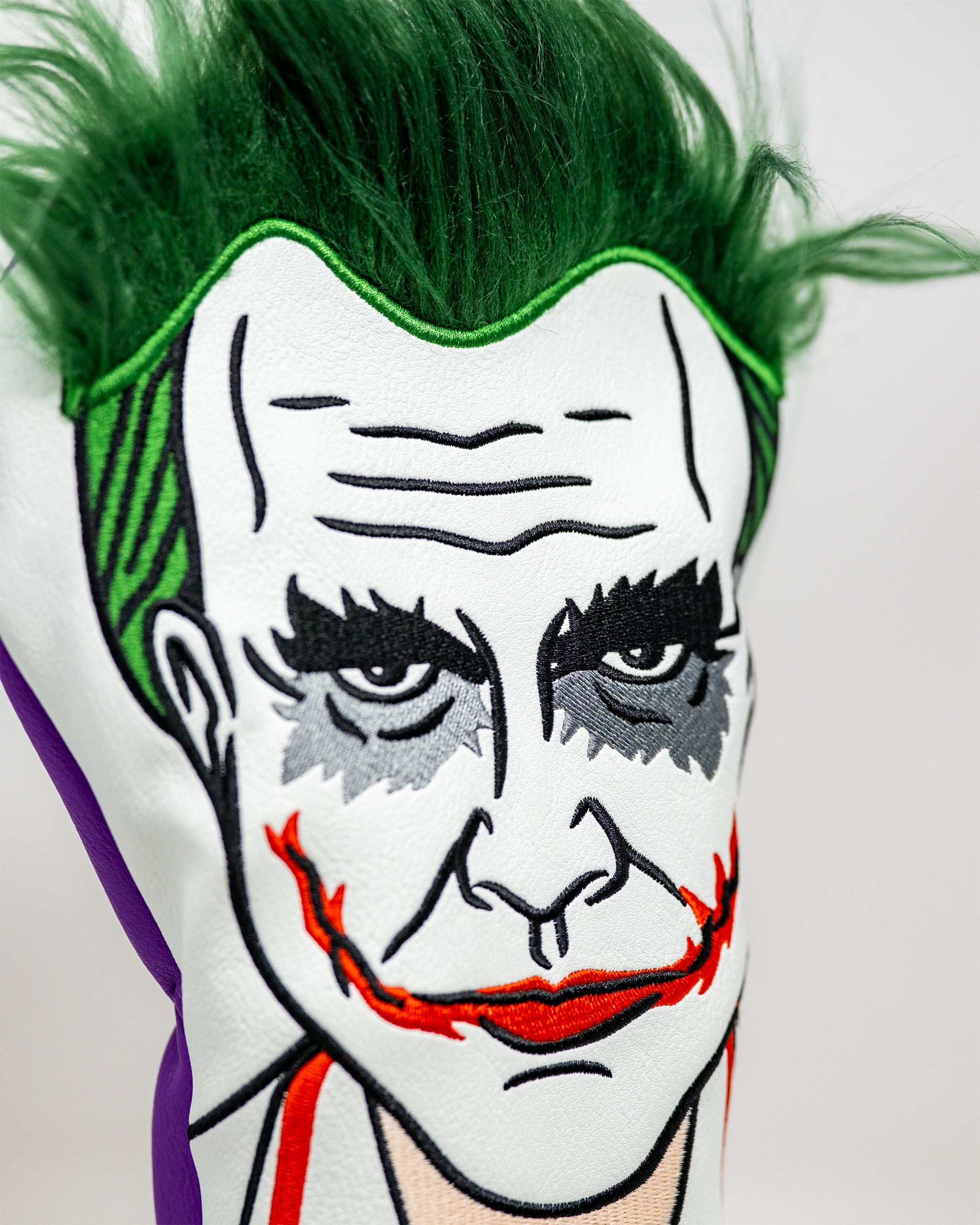 Nurse Joker driver cover with vibrant colors and playful design, featuring a jester motif and a smiling joker face.