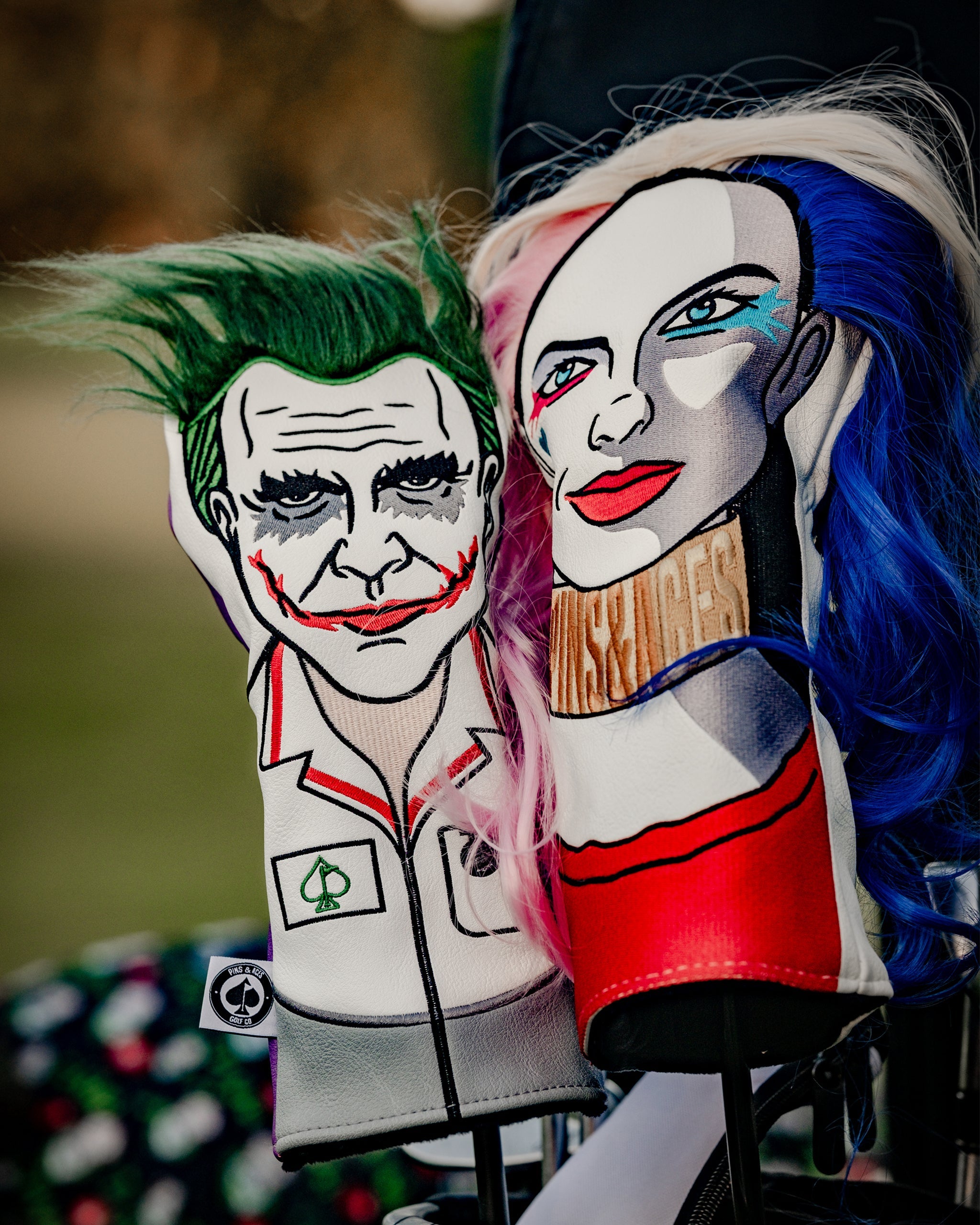 Colorful embroidered golf headcovers featuring Joker and Harley Quinn designs, bold and unique for standout style on the c...