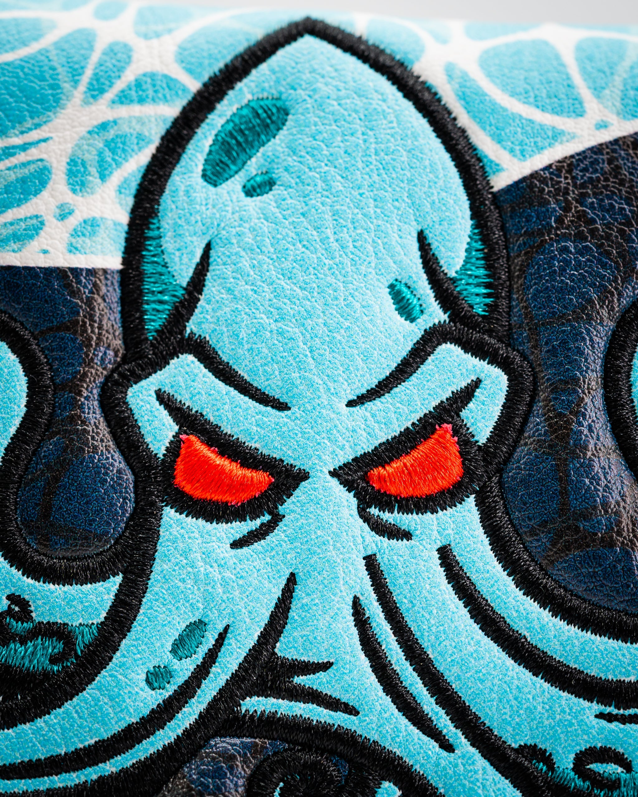 Bold Kraken mallet putter cover featuring a vibrant blue octopus design with striking red eyes and intricate detailing.