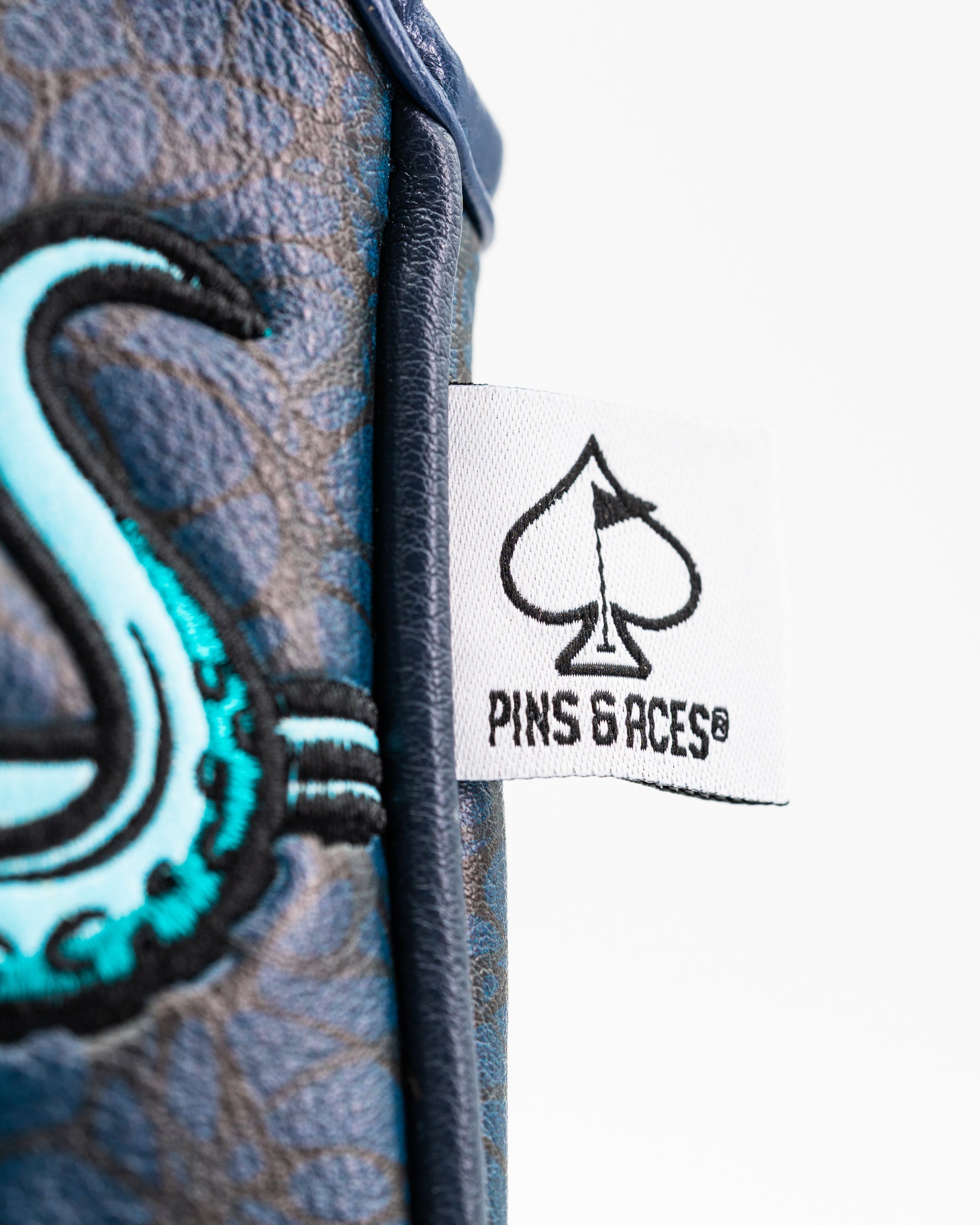 Kraken mallet putter cover featuring a blue design with an octopus graphic and the Pins and Aces logo.