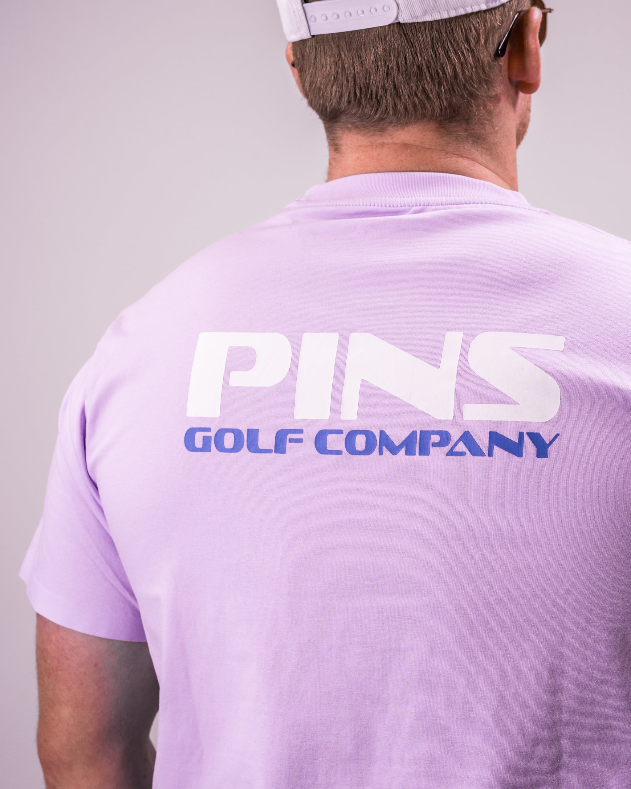 "Casual black Streamliner tee displayed on a wooden surface, showcasing its soft cotton material and relaxed fit."