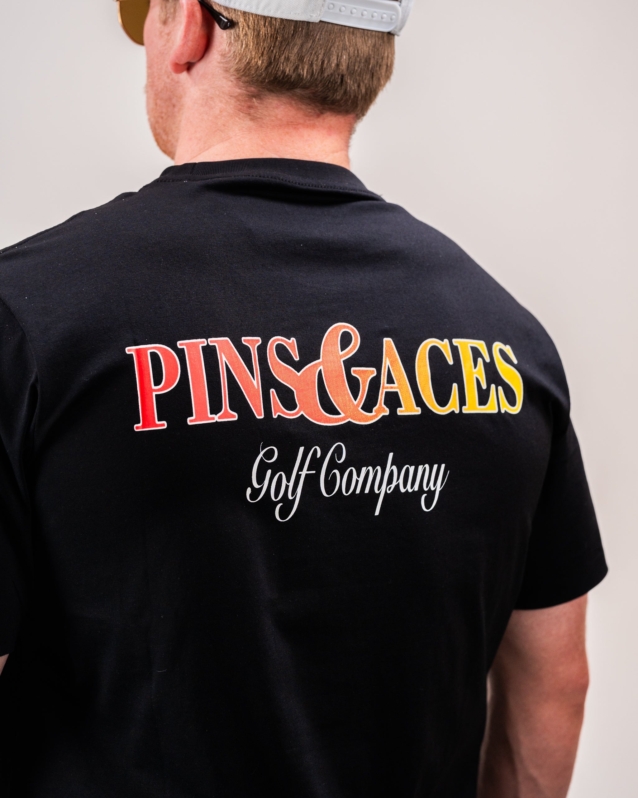 Half&Half graphic tee featuring a split color design in a casual setting.