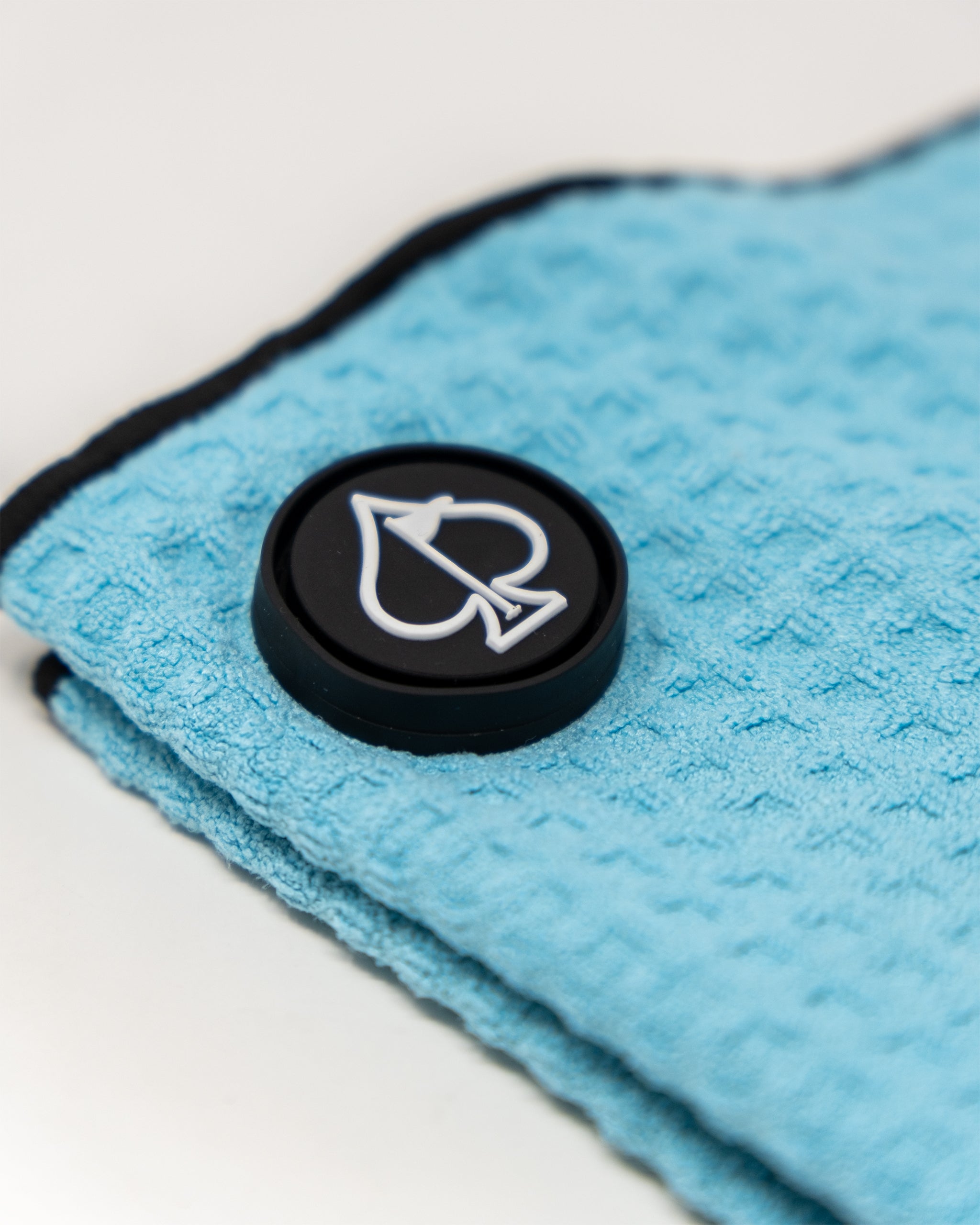 Sky blue magnetic towel displayed on a light background, showcasing its soft texture and embedded magnets for secure attachment.