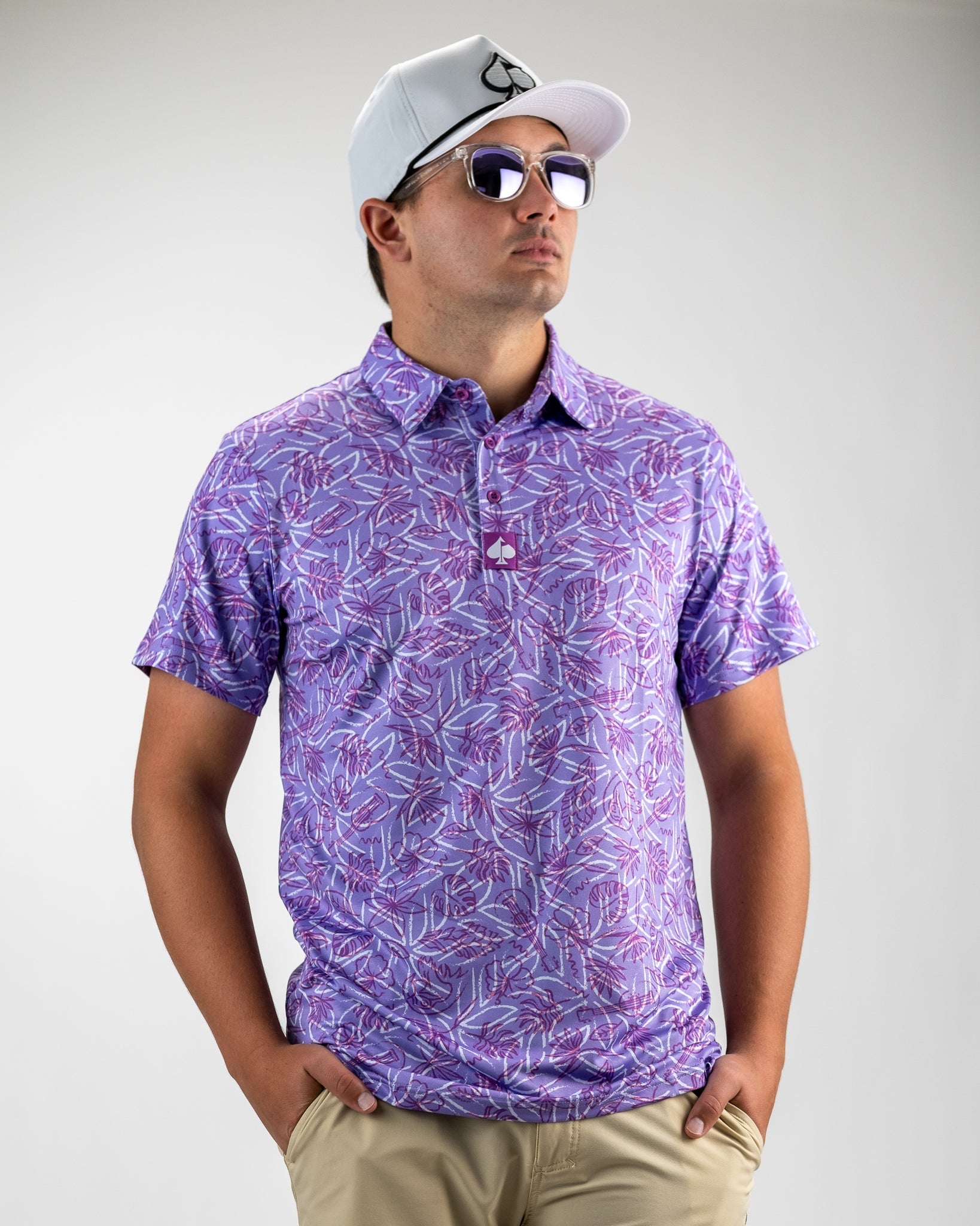 Margaritaville 5 O'Clock Sunset, featuring a vibrant sunset design with palm trees on a soft fabric polo shirt.