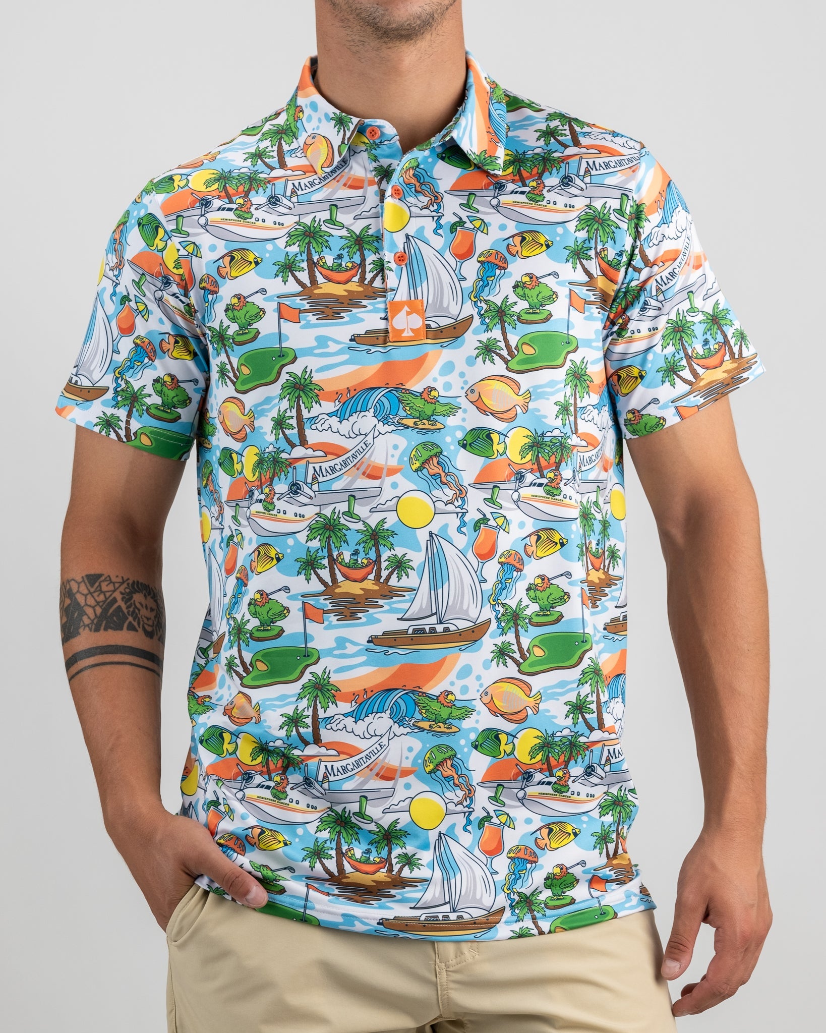 Margaritaville Pins In Paradise shirt featuring a vibrant tropical print with palm trees and beach motifs.