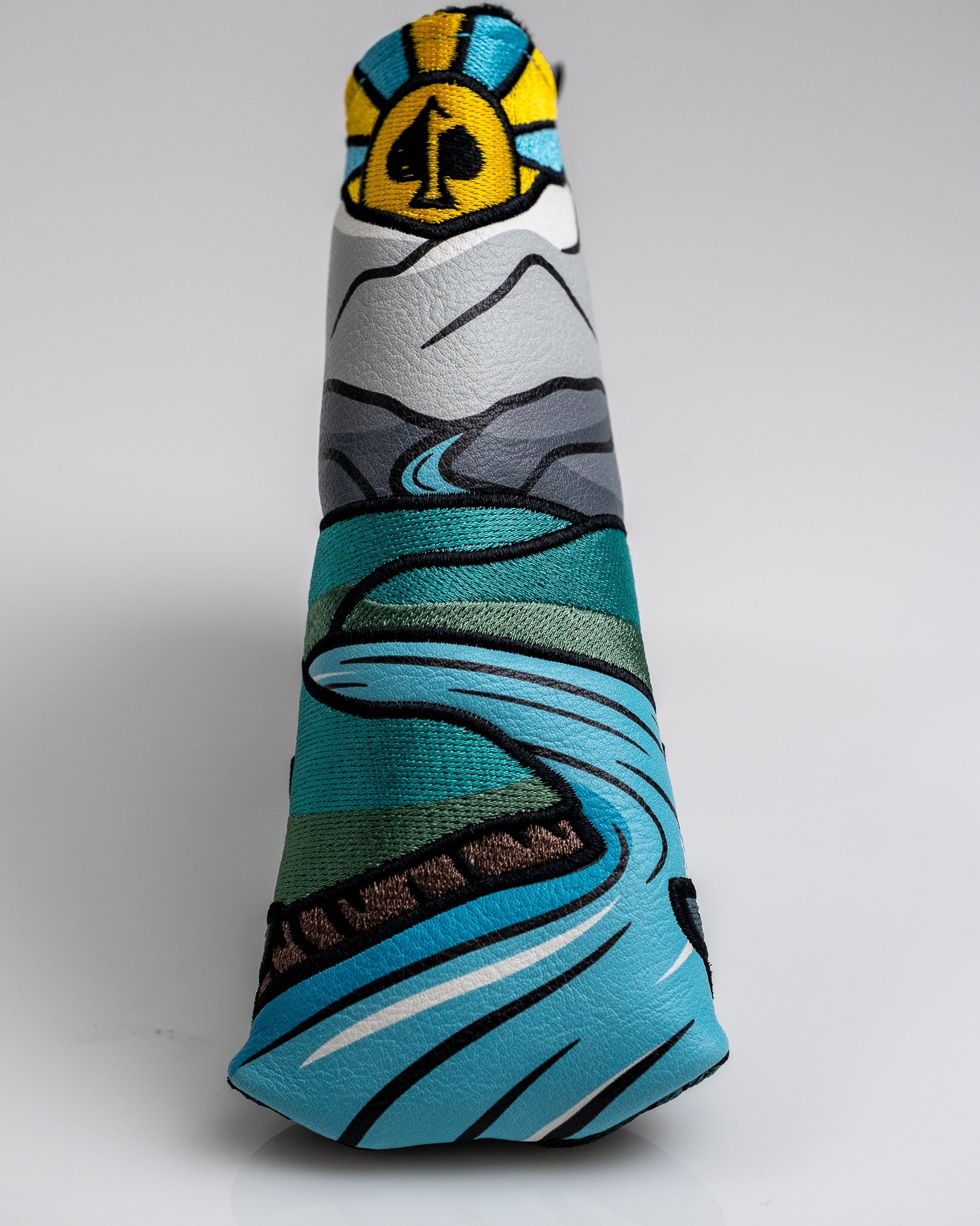 Colorful golf headcover featuring a mountain landscape with a river, designed for golfers who want bold, unique accessories.