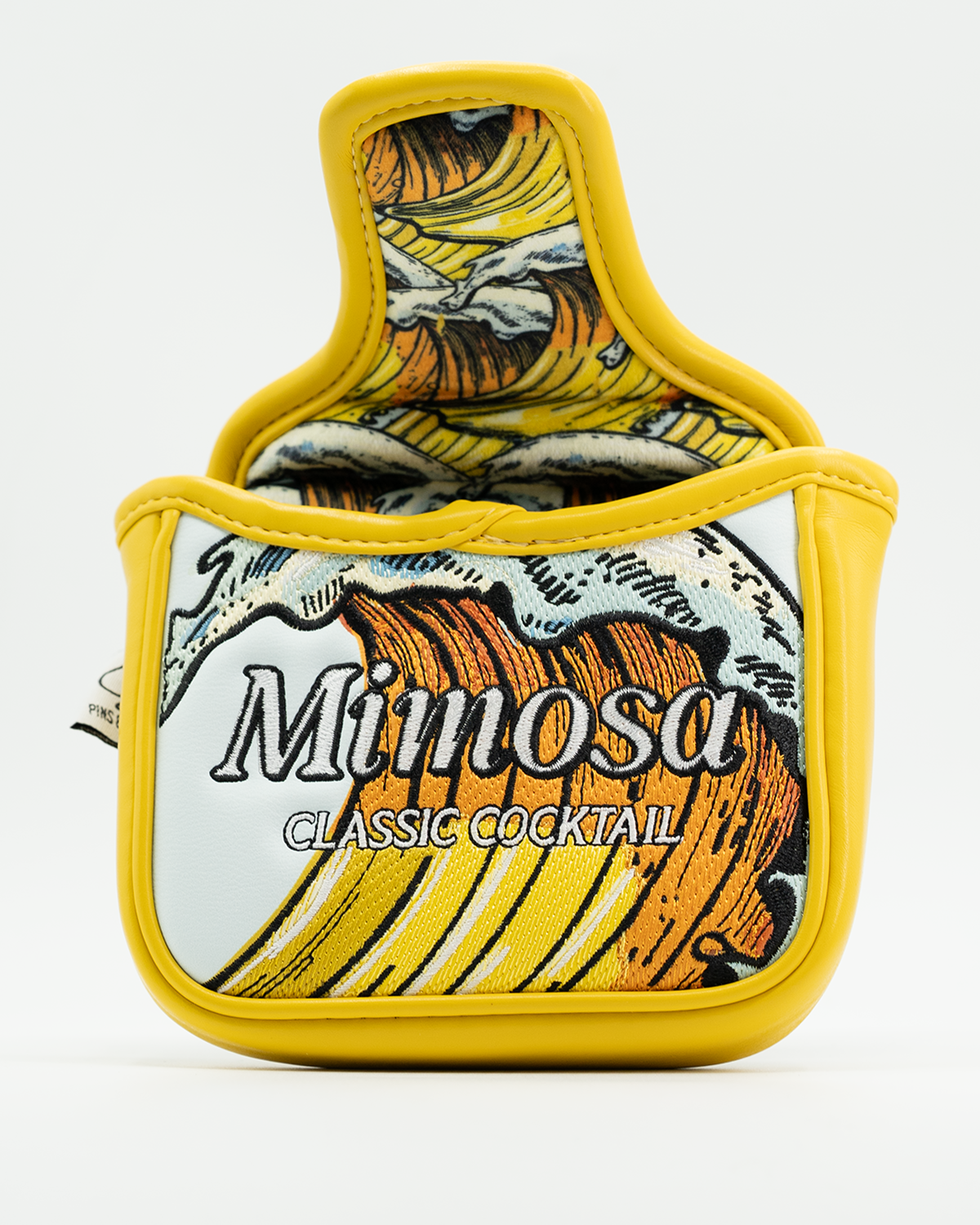 Mimosa mallet putter cover featuring a vibrant yellow design with classic cocktail graphics for stylish golf protection.