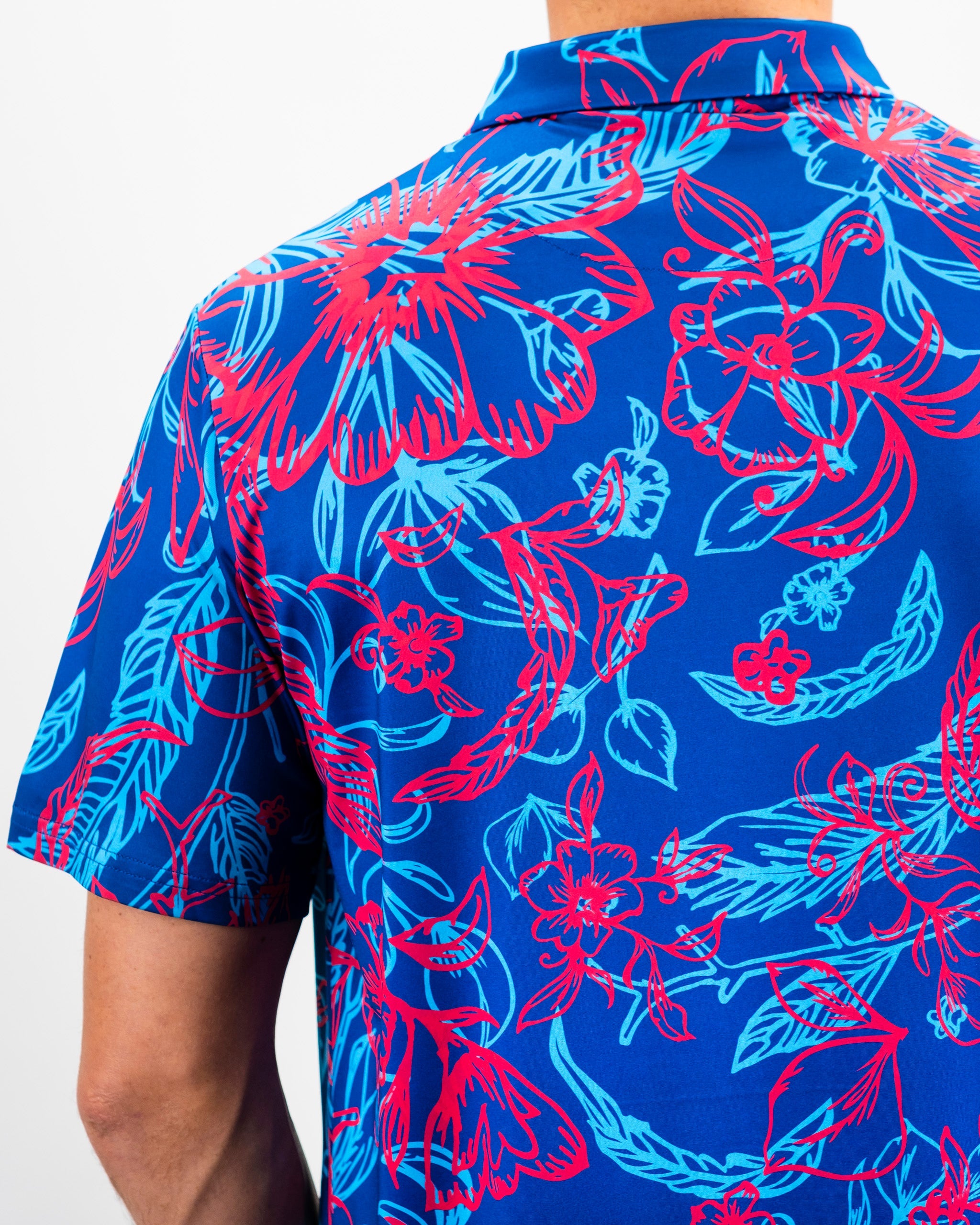 Cabo Colada retro-style polo shirt featuring a vibrant design with tropical motifs and a relaxed fit.