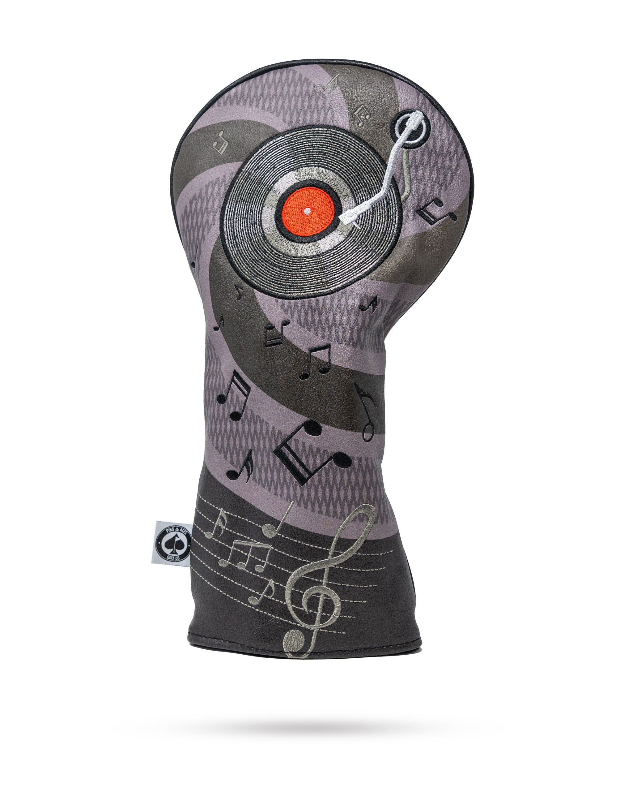 Music City driver headcover featuring a vibrant design with musical notes and a classic city skyline, ideal for golf enthusiasts.