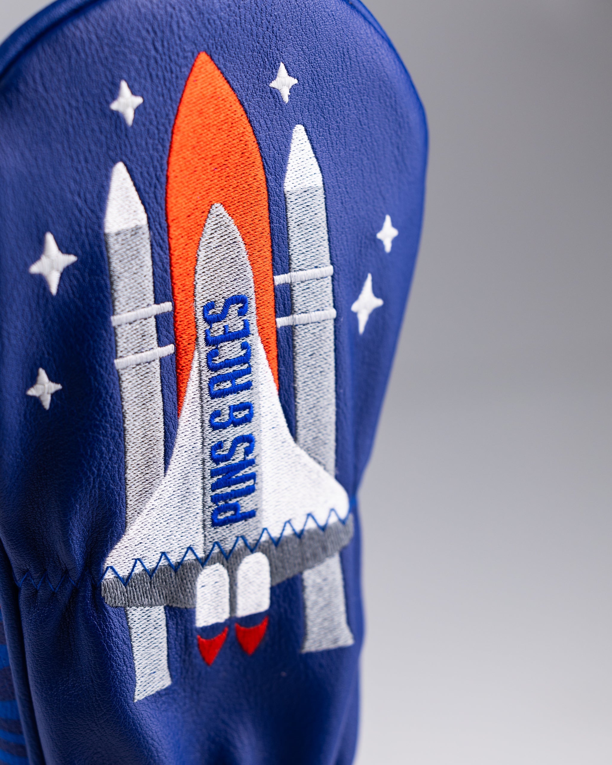 NASA Space Walk Fairway Cover featuring a vibrant design of astronauts and space elements for golfers.