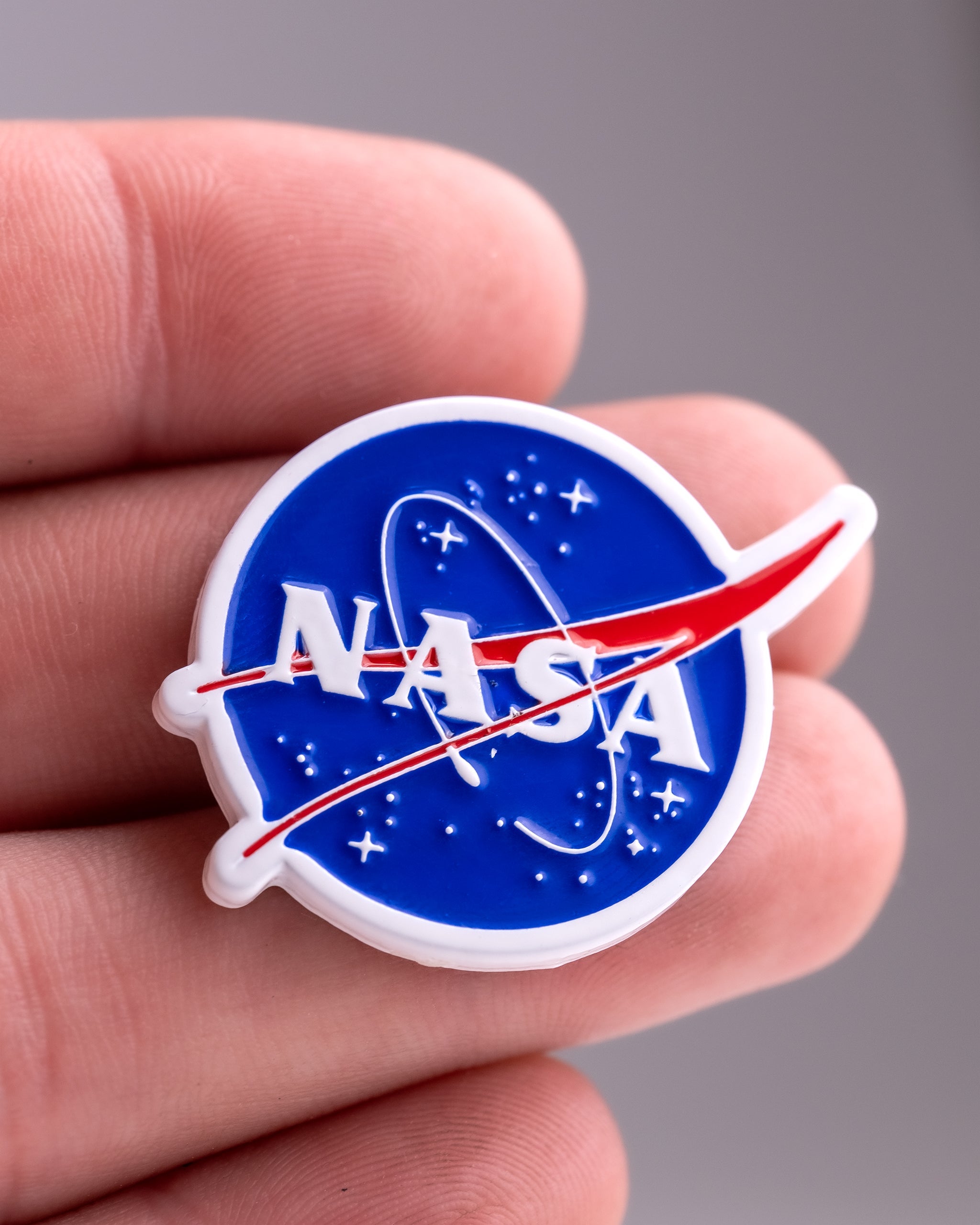 NASA "Meatball" ball marker featuring the iconic NASA logo in vibrant colors, suitable for golfing enthusiasts.