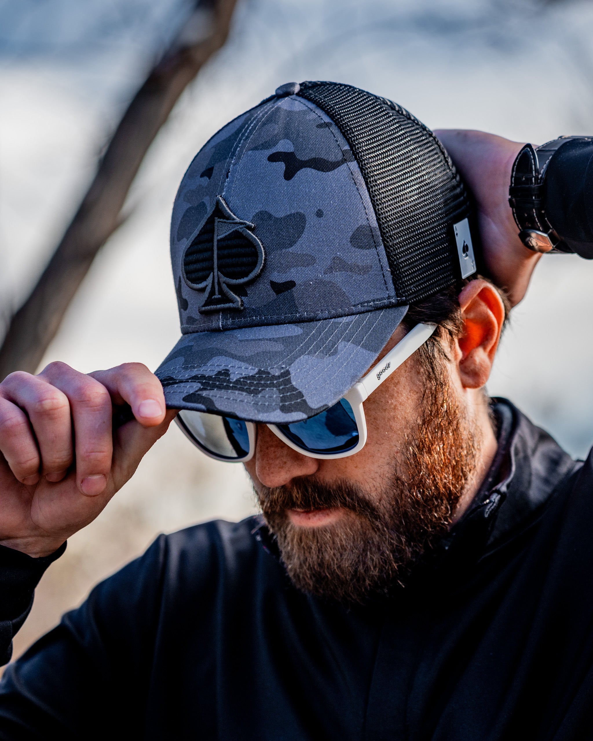 Urban camo trucker hat with mesh back and adjustable snap closure.