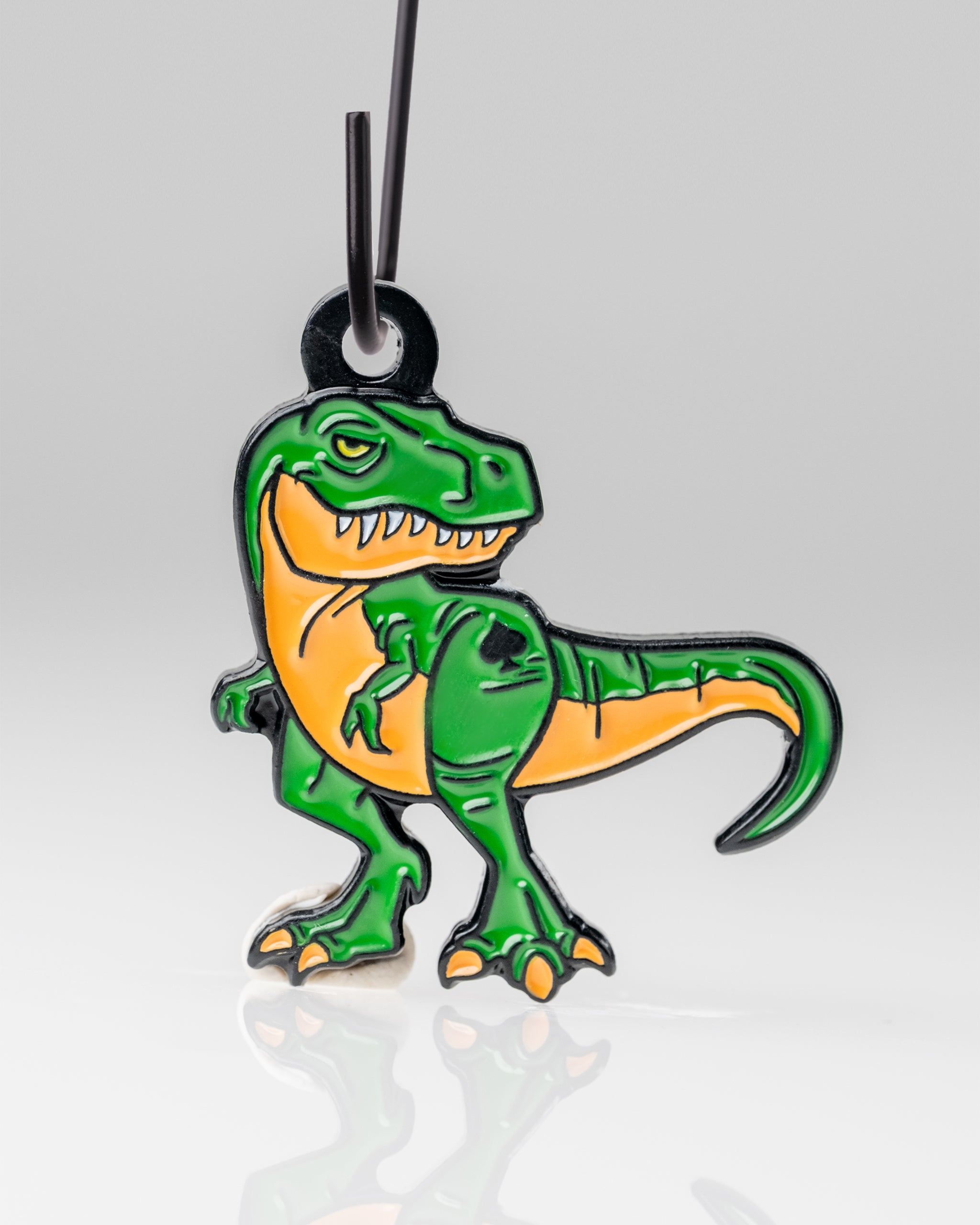 T-Rex ornament in vibrant green color, featuring detailed scales and a festive design, perfect for dinosaur-themed holiday decor.