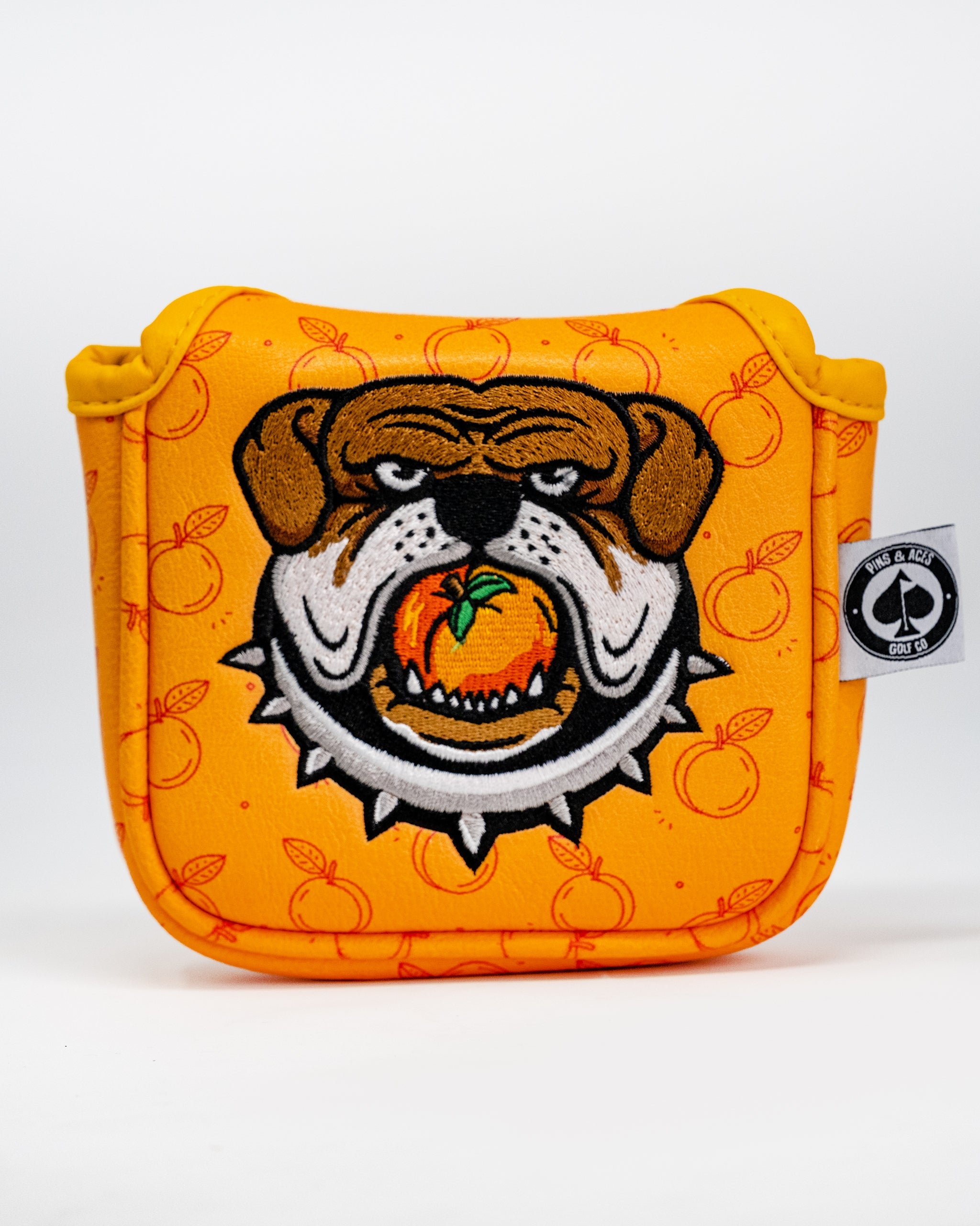 Dawg Country Mallet Cover featuring a playful dog design, suitable for golf putters, in vibrant colors on a soft fabric background.