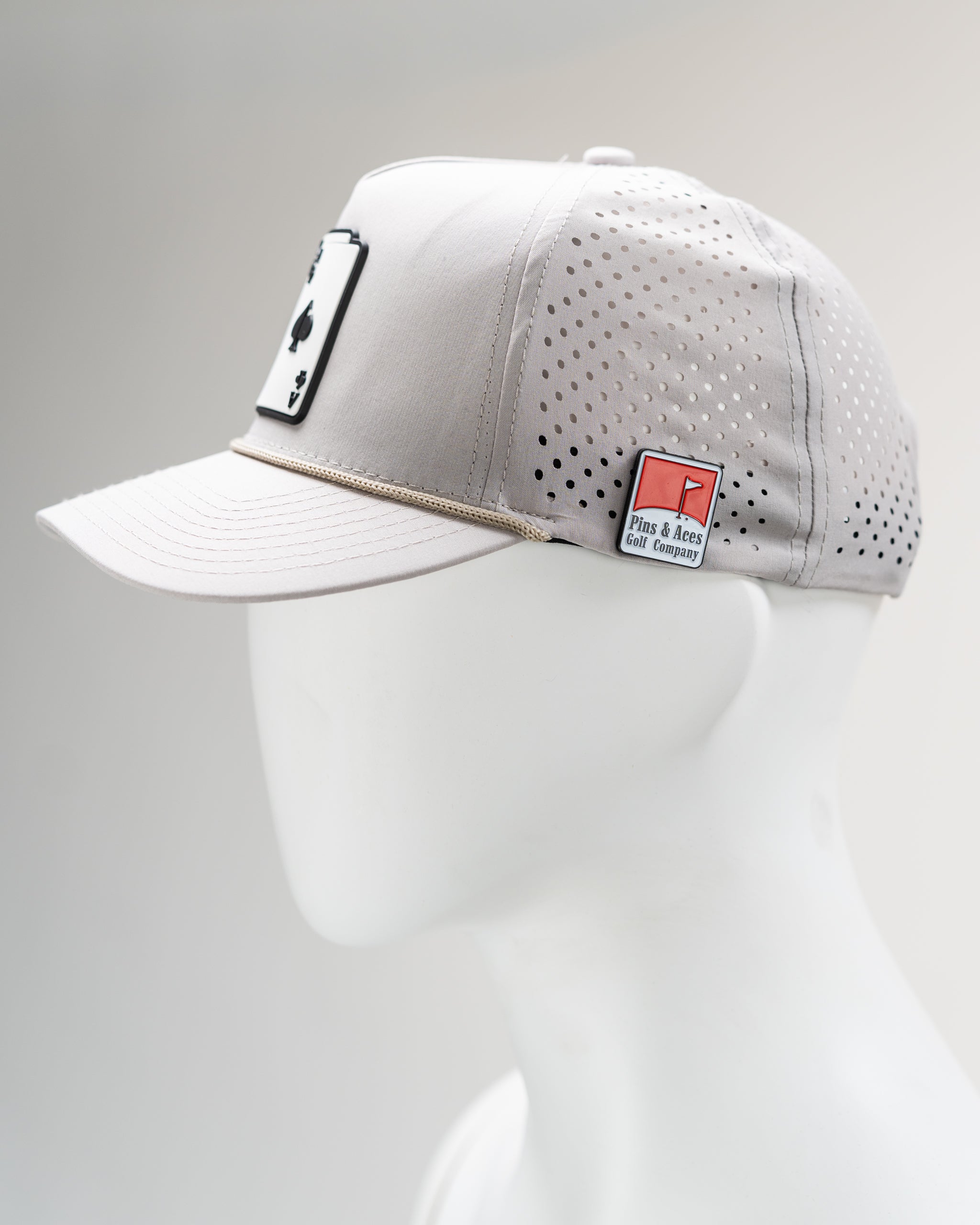 Perforated Bone-colored Rope Hat with AK logo.