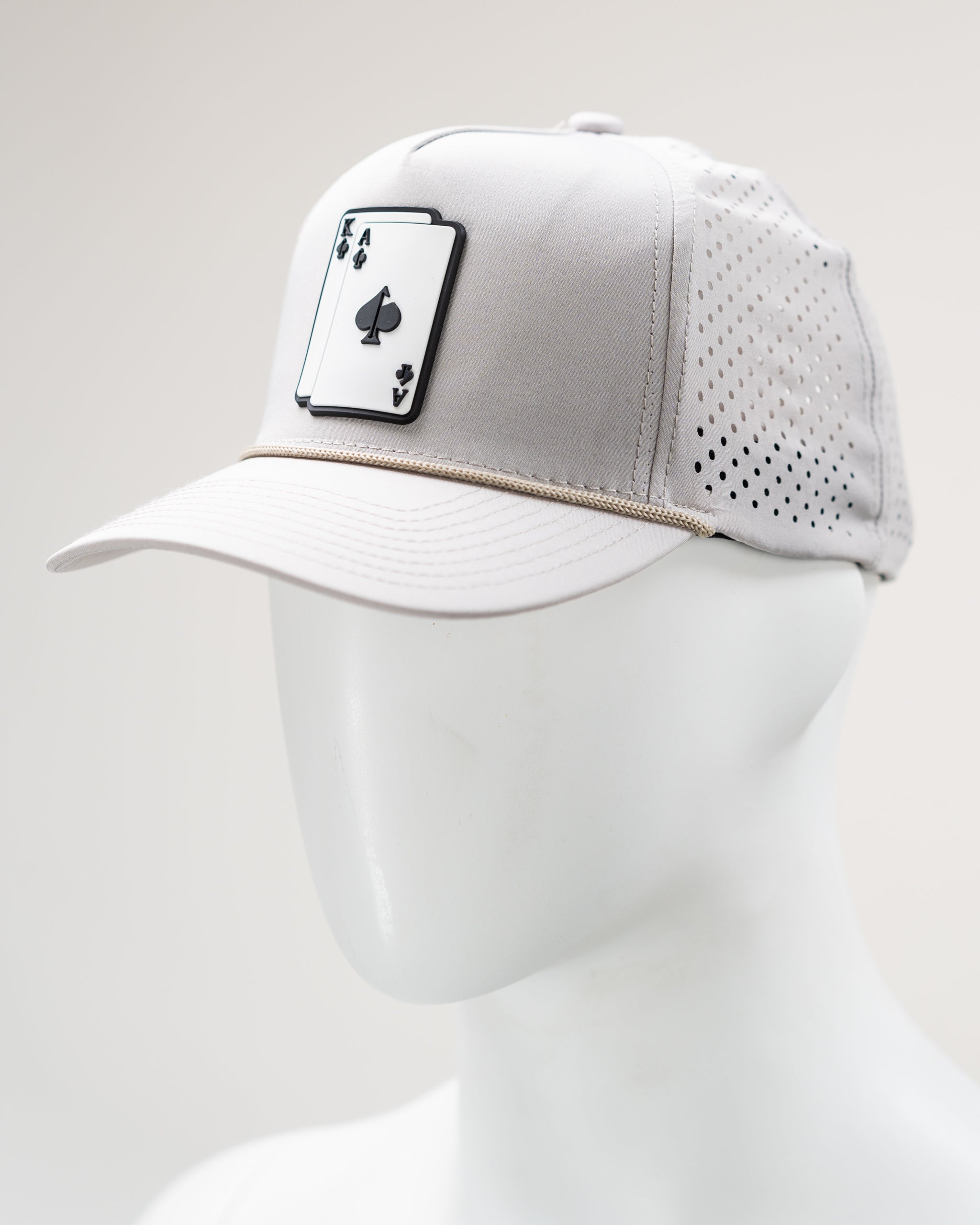 Perforated rope hat in bone color with 'AK' embroidered logo on the front.