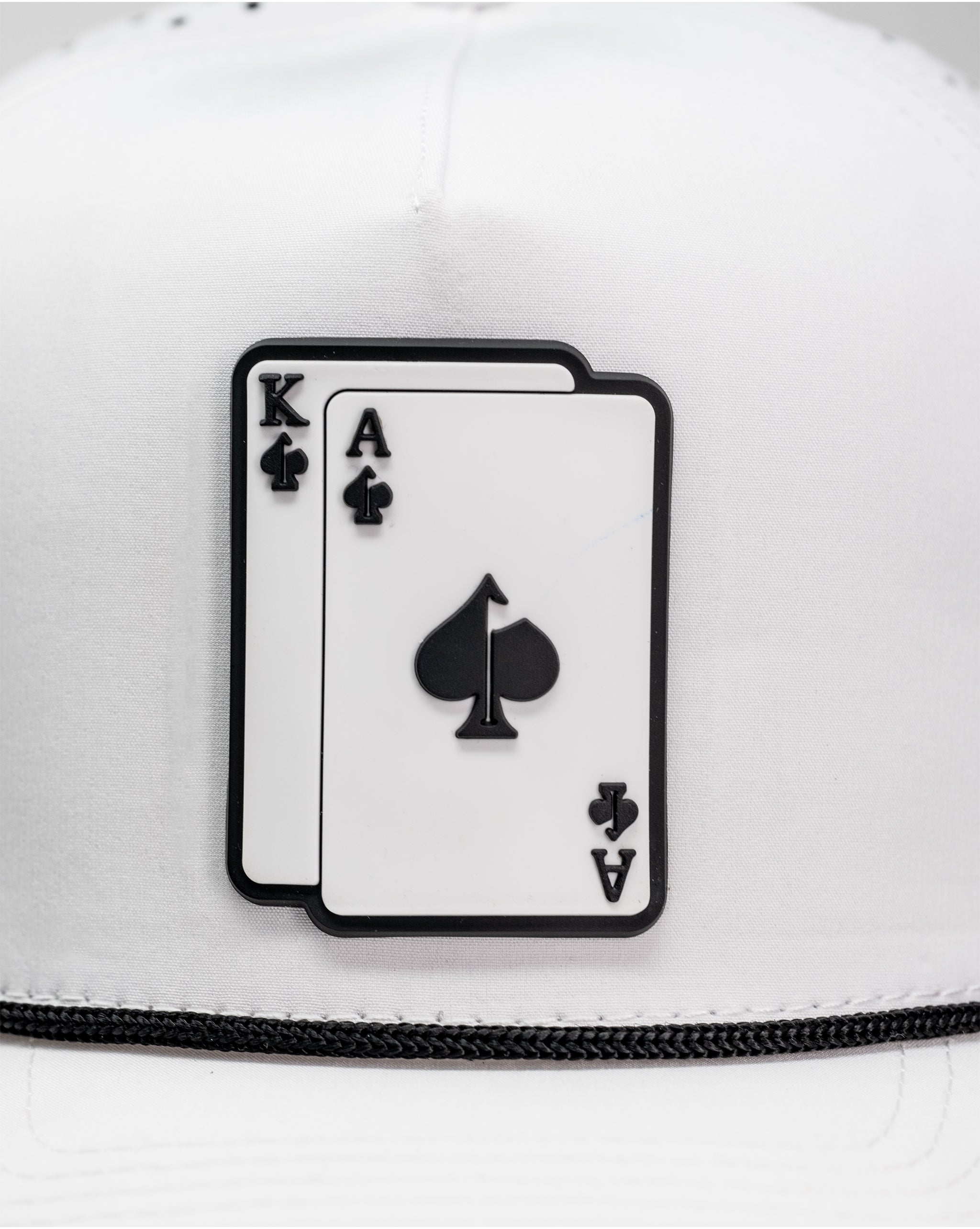 Perforated white rope hat featuring an embroidered AK logo on the front.