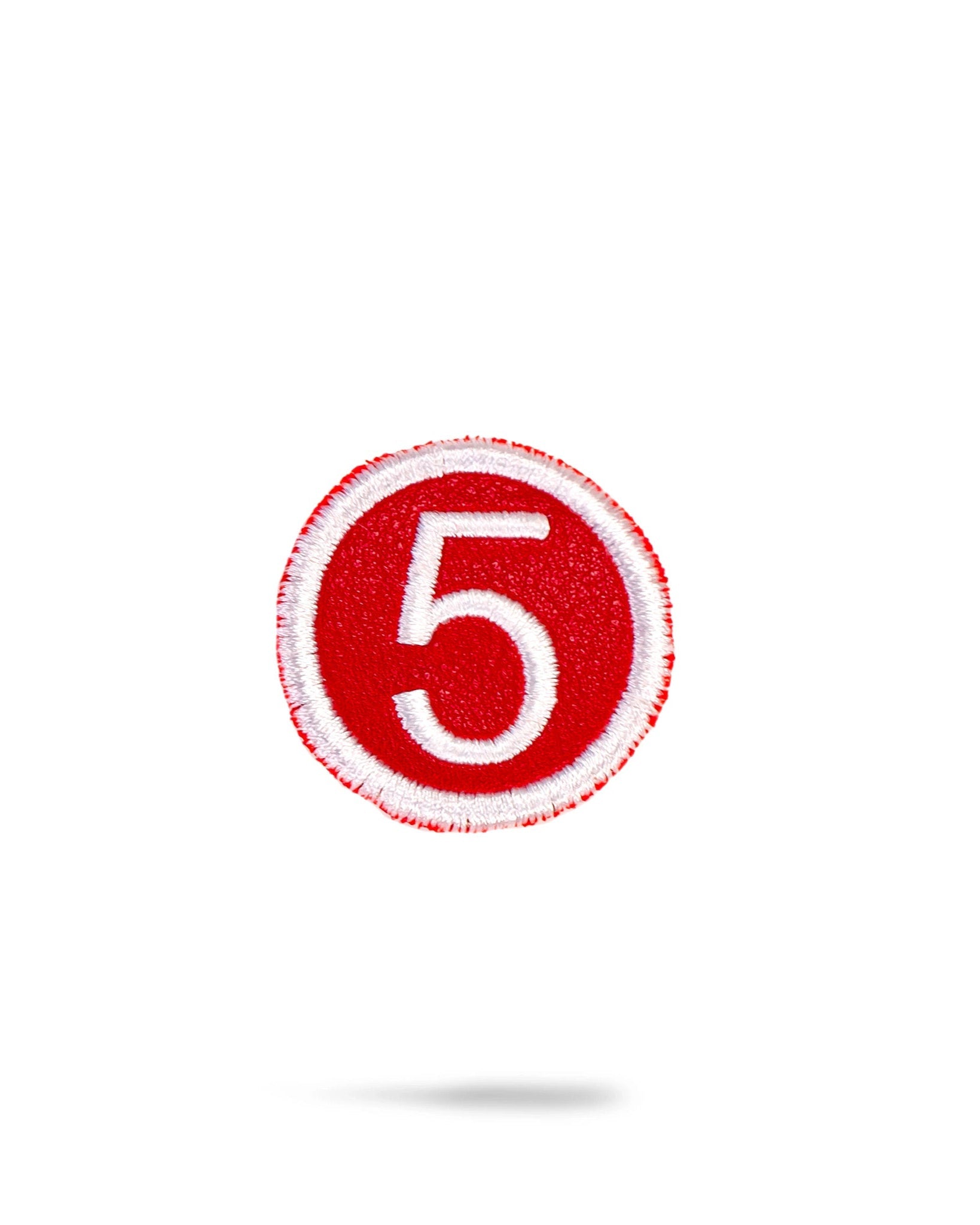 Red headcover patch featuring a bold design suitable for embroidery or decoration.