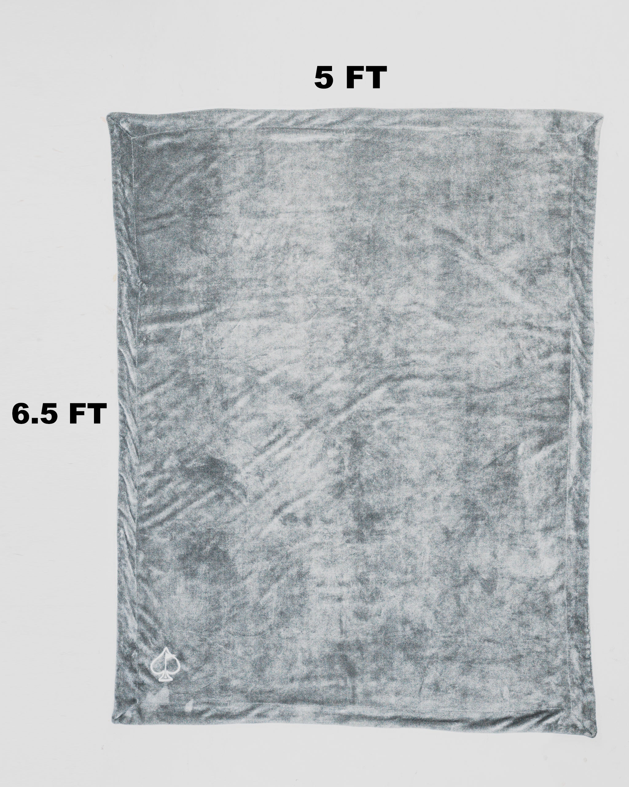 Light gray Bogey Blanket displayed on a flat surface, showcasing its soft texture and ample size.