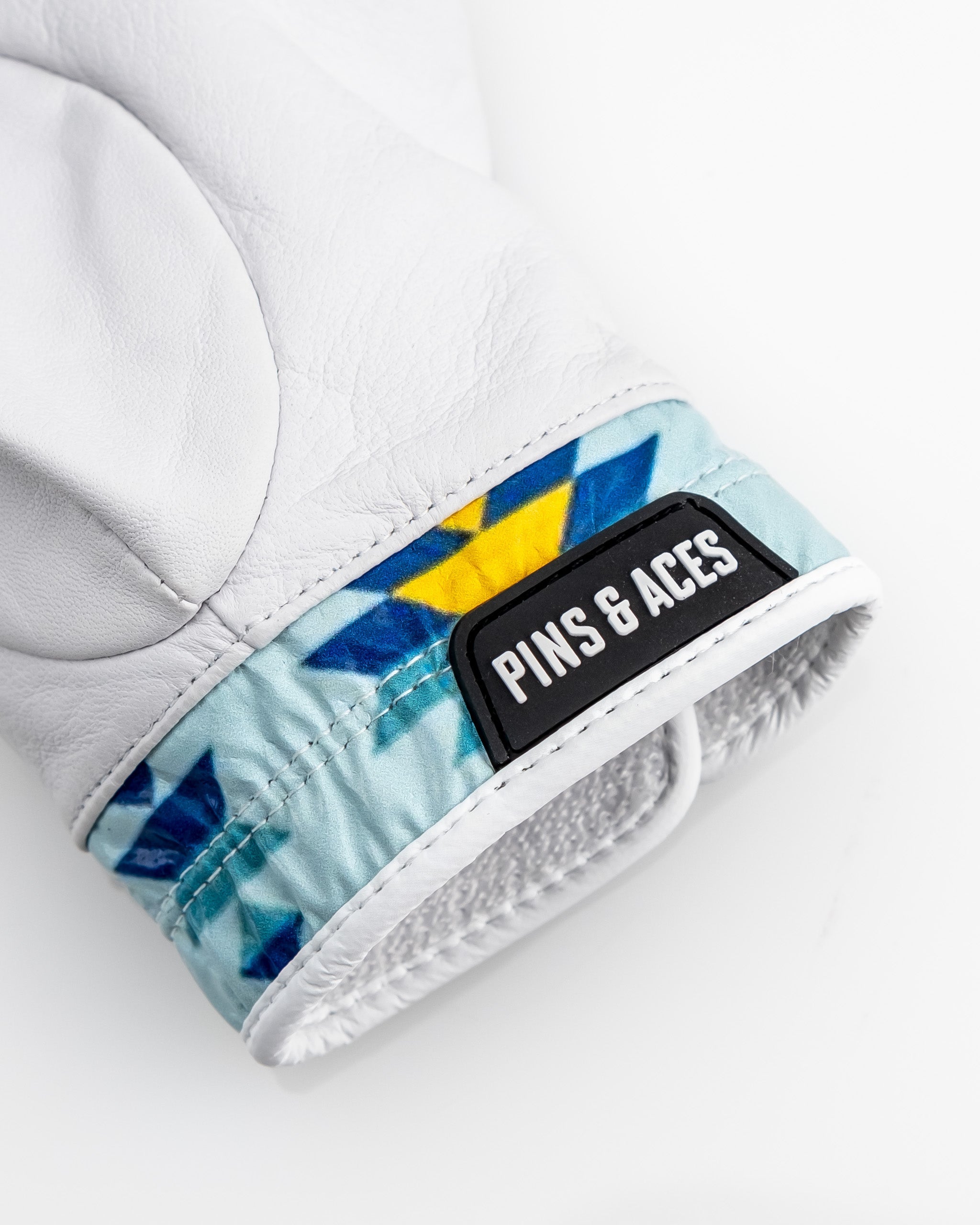 Premium Tour Glove in Southwest Sunset design with vibrant orange and purple hues.