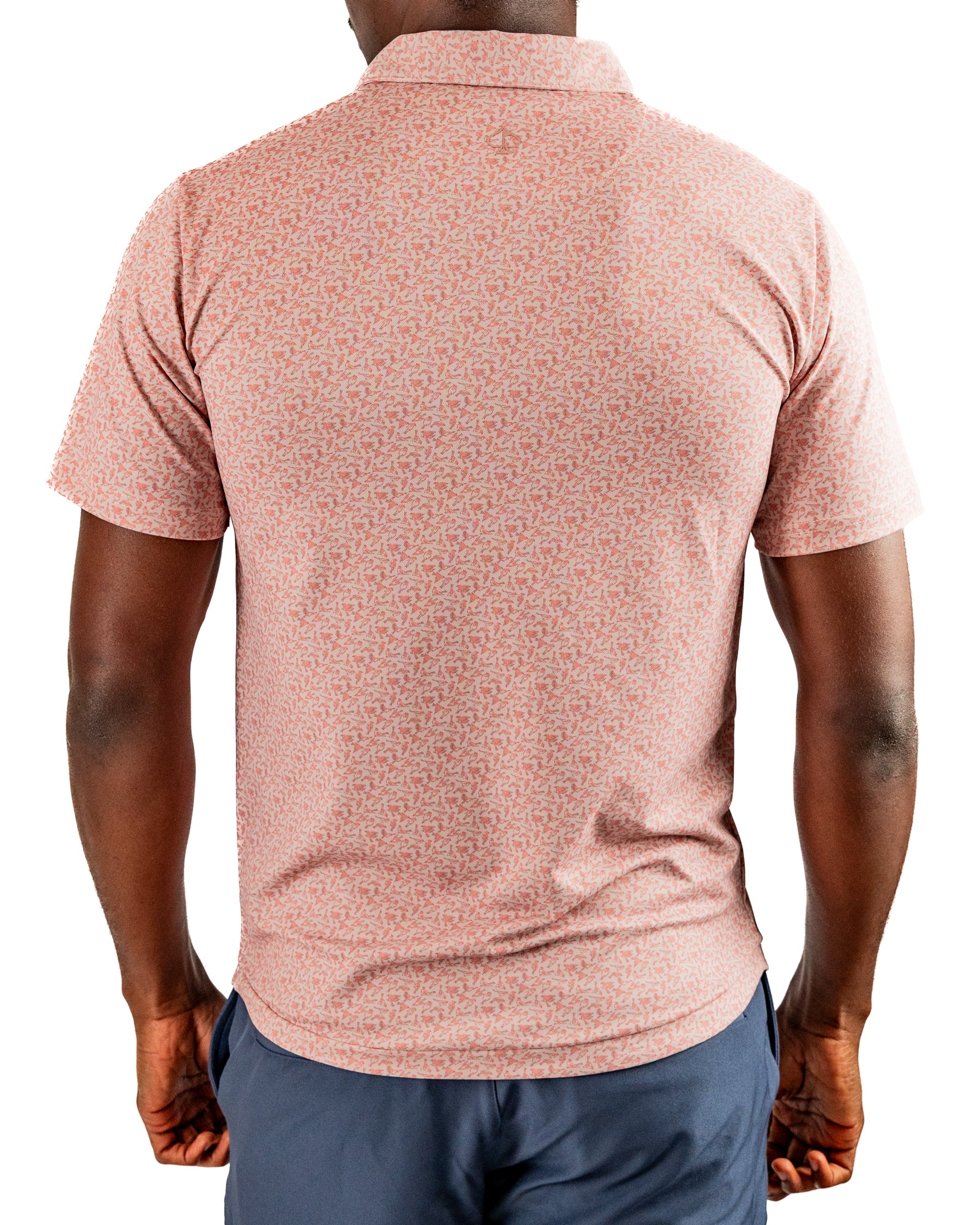Men's short-sleeve golf polo in a soft pink hue featuring a subtle pattern, designed for comfort and style on the course.