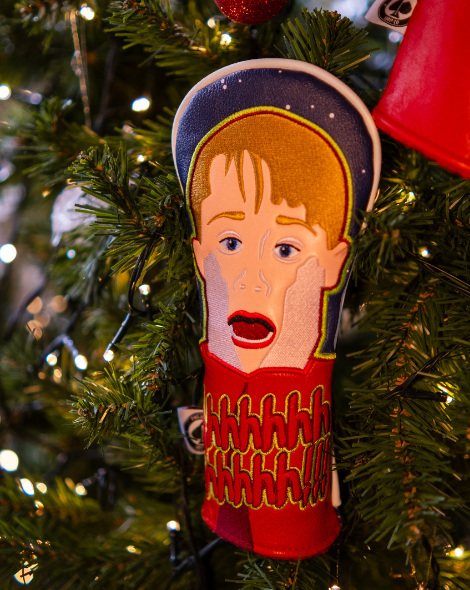 Bold golf headcover featuring a cartoon character with a shocked expression, perfect for adding fun to your golf game.