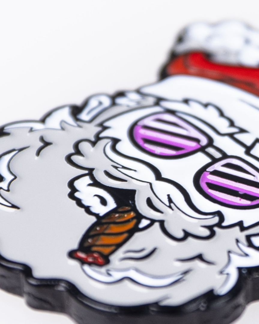 Bold Santa-themed ball marker featuring a playful design with sunglasses and a cigar, perfect for unique golf accessories.
