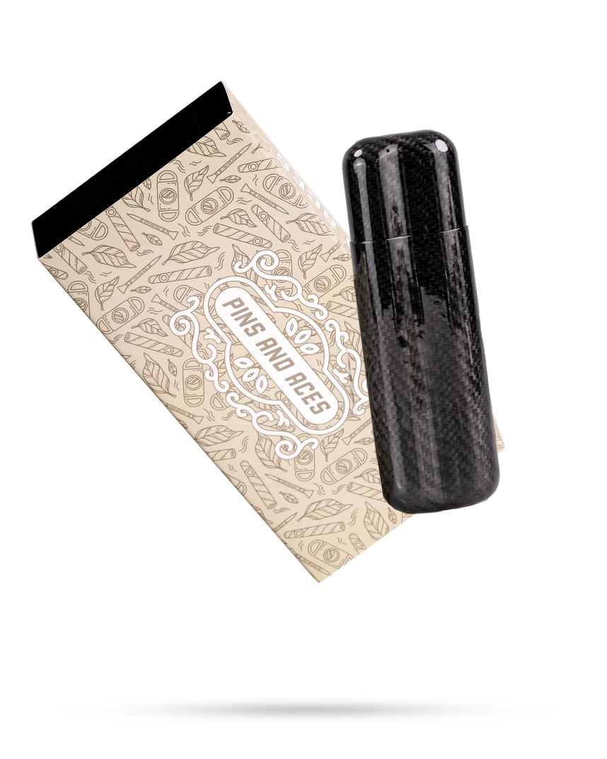 Sleek carbon fiber cigar case with two slots, accompanied by a stylish patterned box from Pins and Aces.