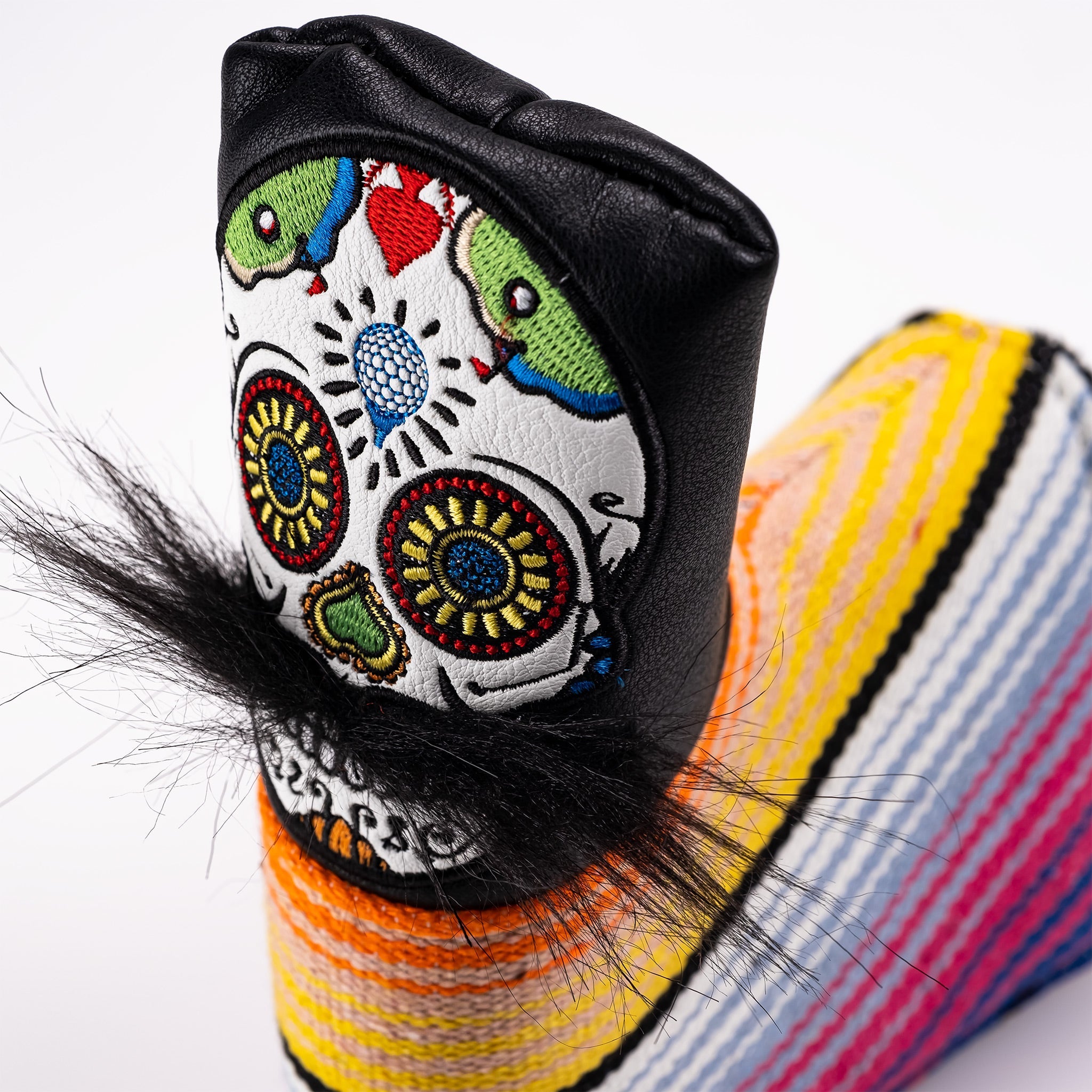 Bold black putter cover featuring a colorful mustache sugar skull design and vibrant striped accents for standout style.