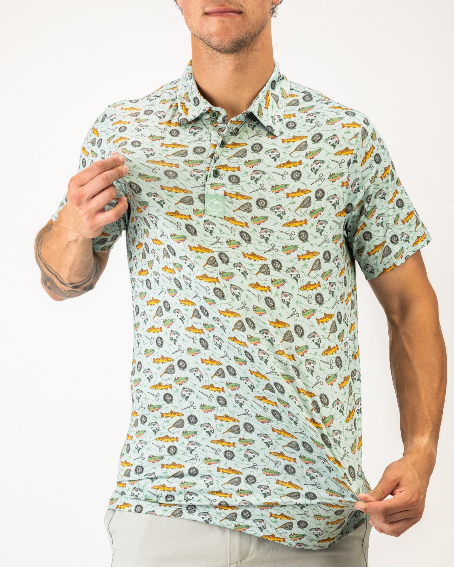 Men's short-sleeve polo shirt featuring a playful fish and fishing-themed print, perfect for stylish golfers.