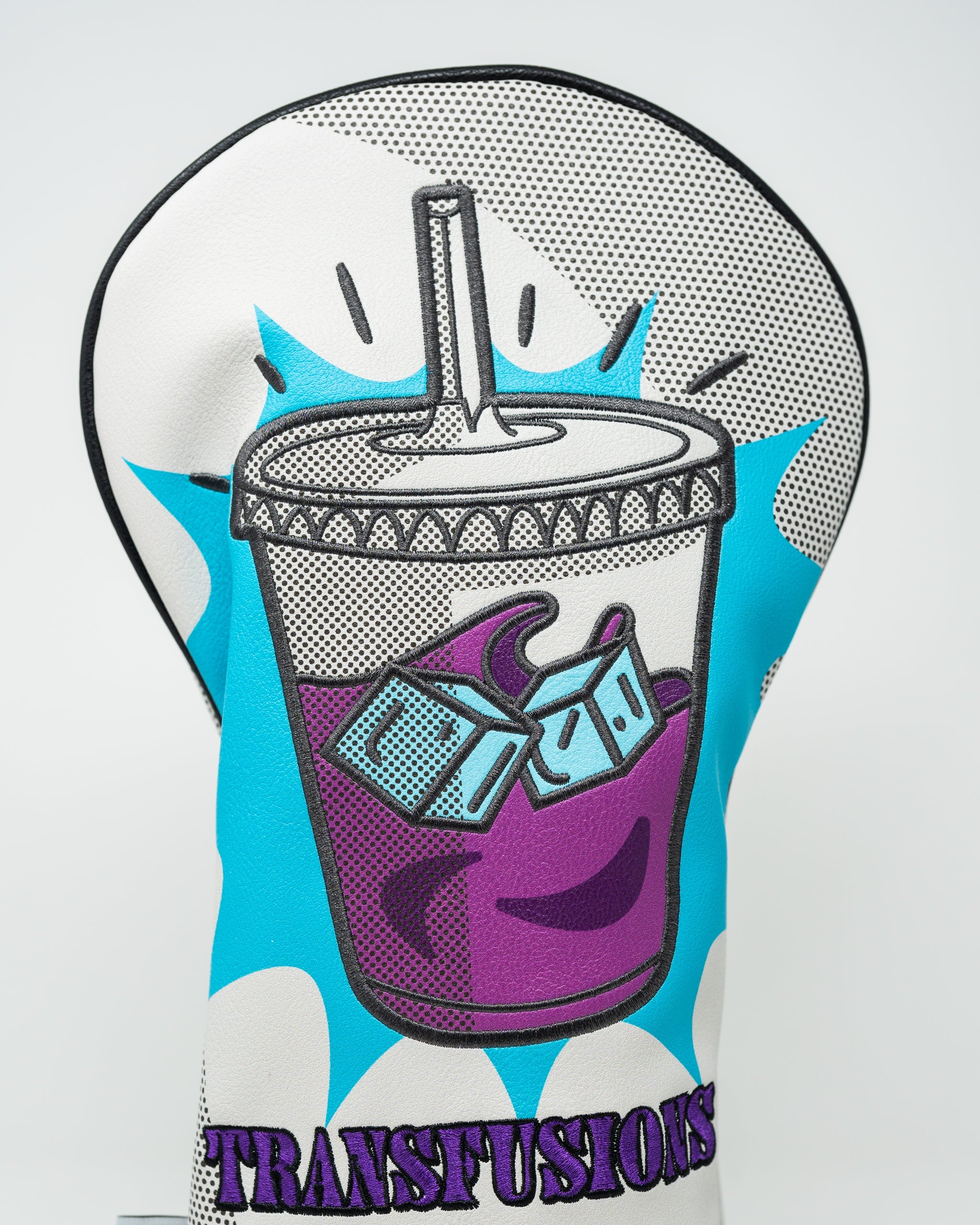 Bold golf driver cover featuring a colorful graphic of a drink cup with ice, labeled "TRANSFUSIONS" for a standout look.