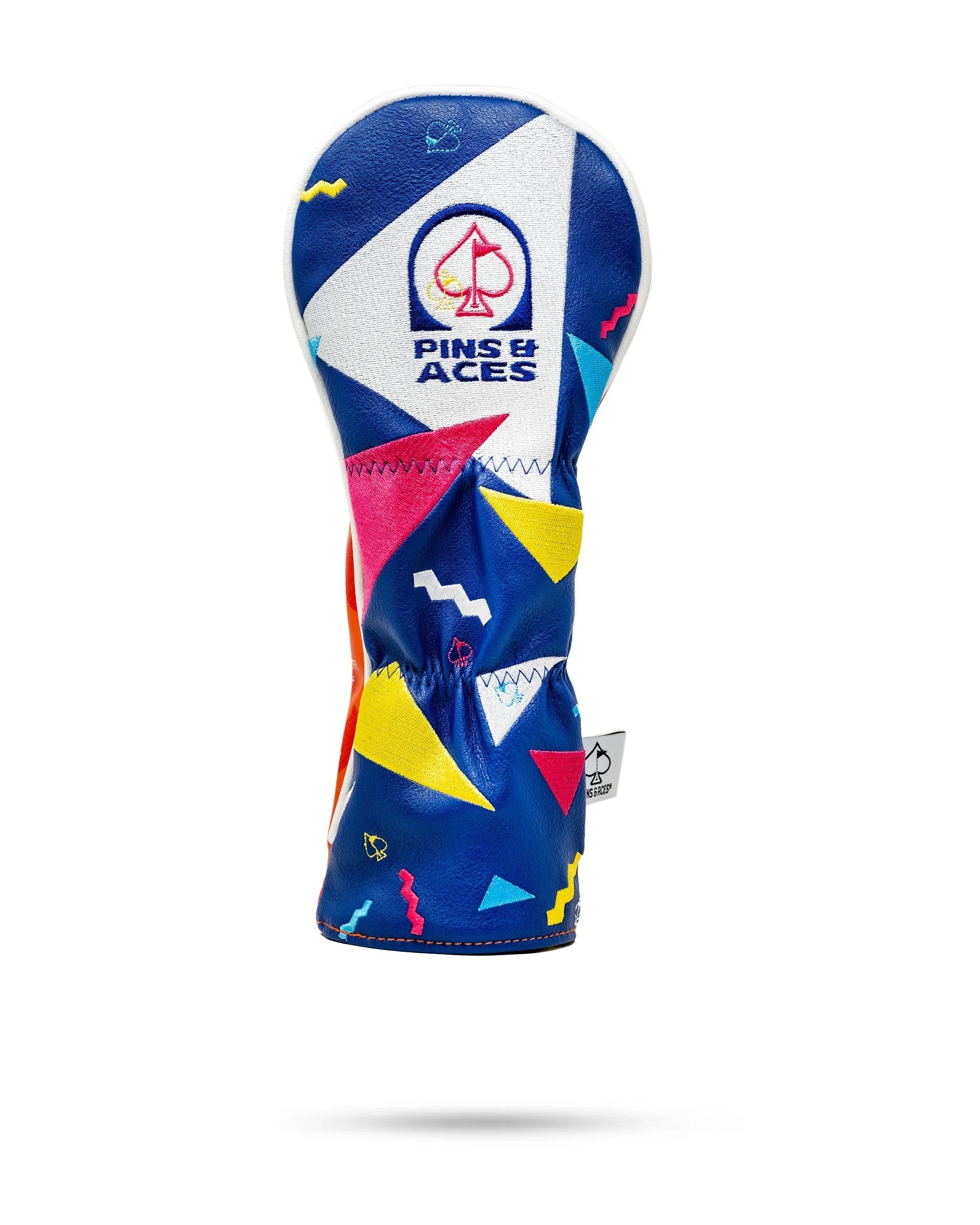 Bold blue golf headcover featuring vibrant geometric patterns and the Pins and Aces logo, designed for style on the course.