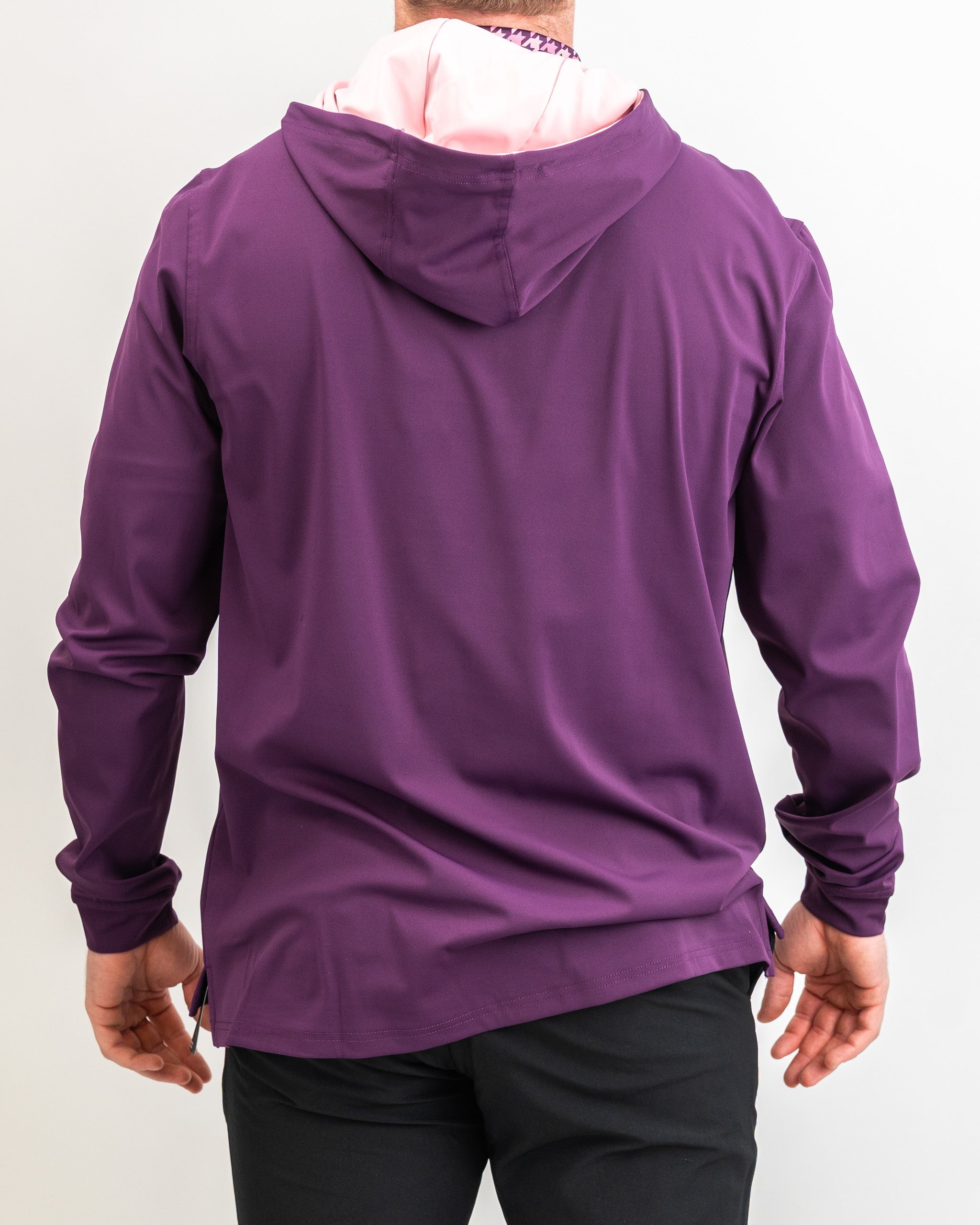 Men's performance golf hoodie in houndstooth raspberry, featuring a stylish design and comfortable fit for on-course wear.