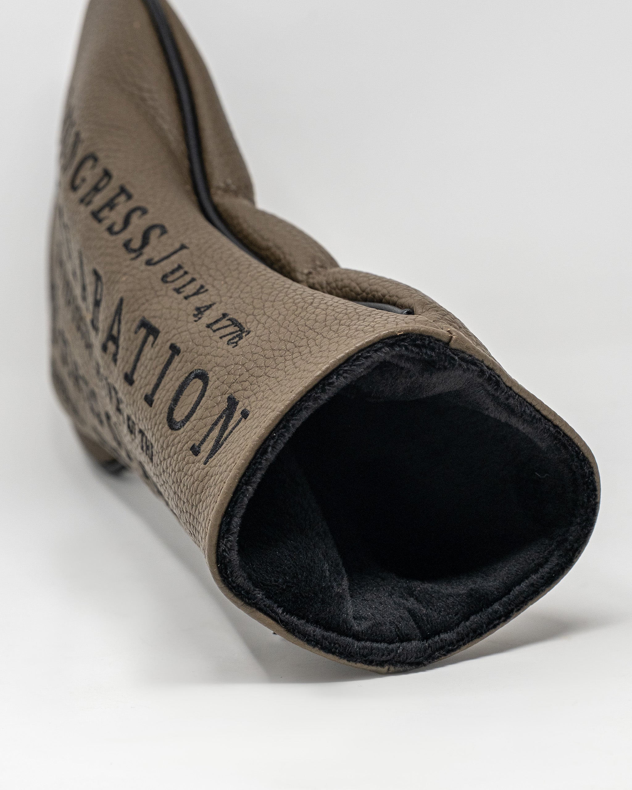 Stylish driver cover featuring a textured leather design with "Declaration" text, perfect for golfers seeking uniqueness.